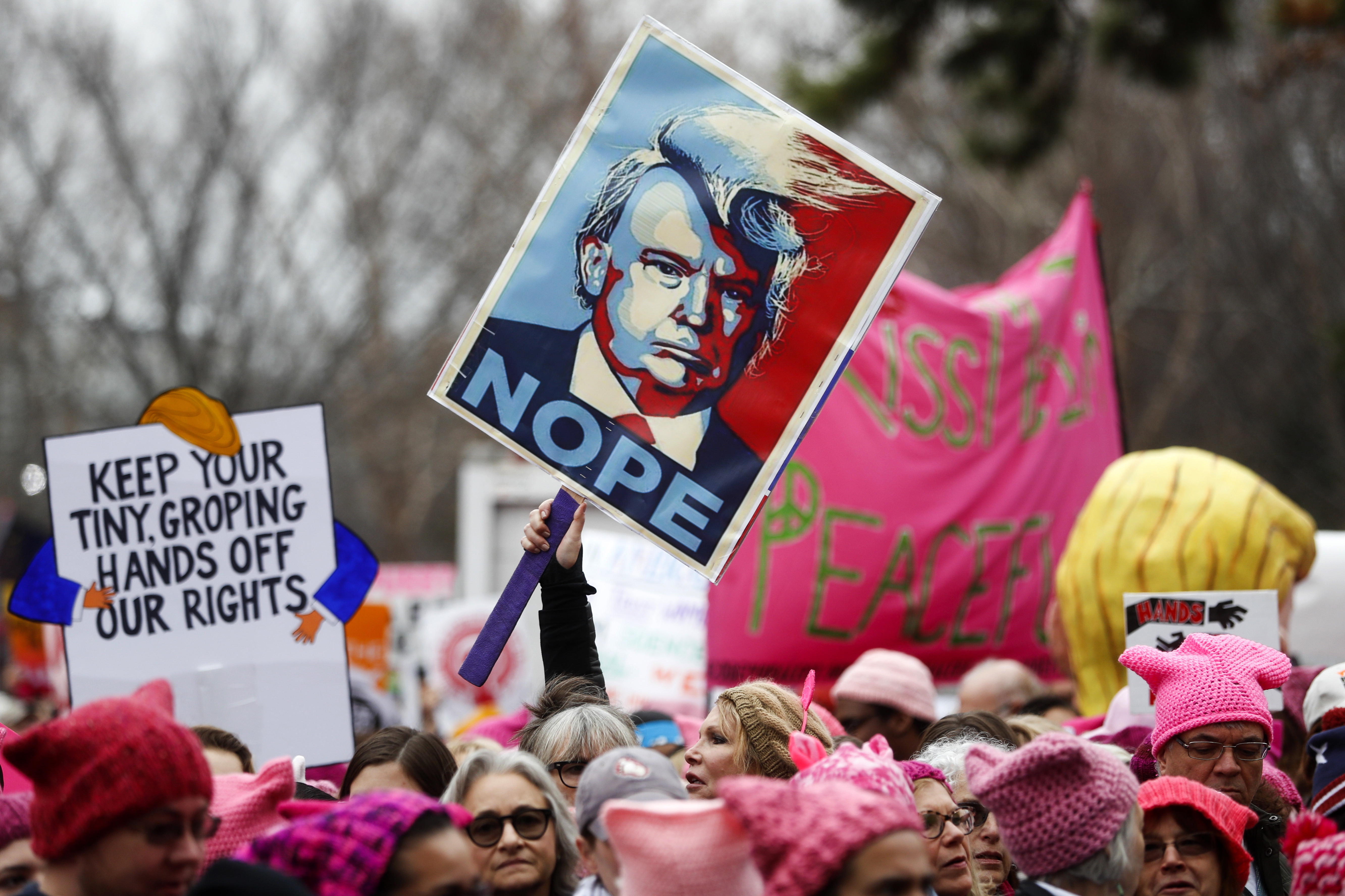Protesters gather beside the stage at the Women's March on Washington during the first full day of Donald Trump's presidency, Saturday, Jan. 21, 2017 in Washington. (AP Photo/John Minchillo)