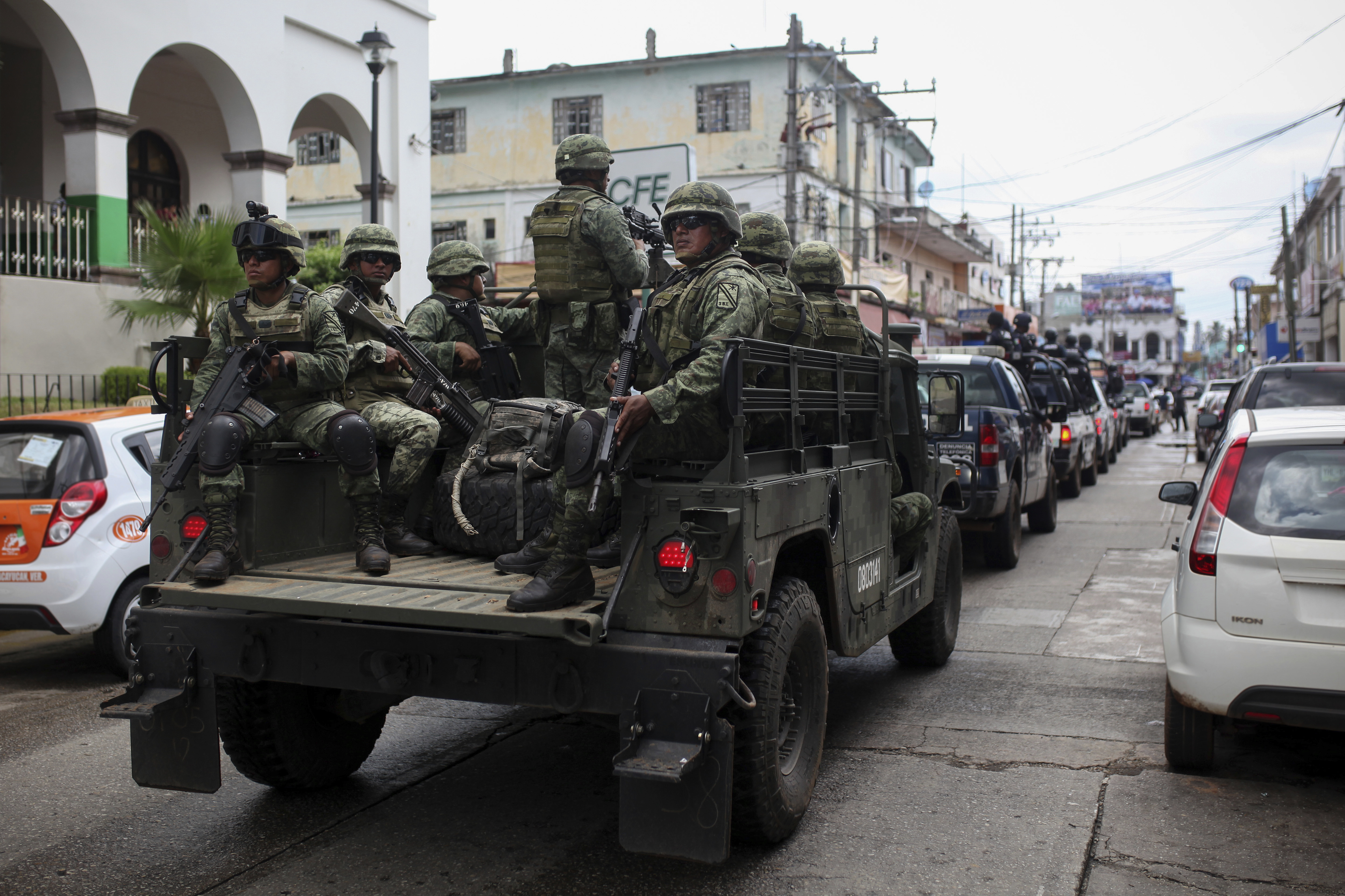 FILE PICTURE: Army soldiers patrol the streets of Acayucan, Veracruz state, Mexico, Tuesday, July 11 2017. (AP Photo/Felix Marquez)