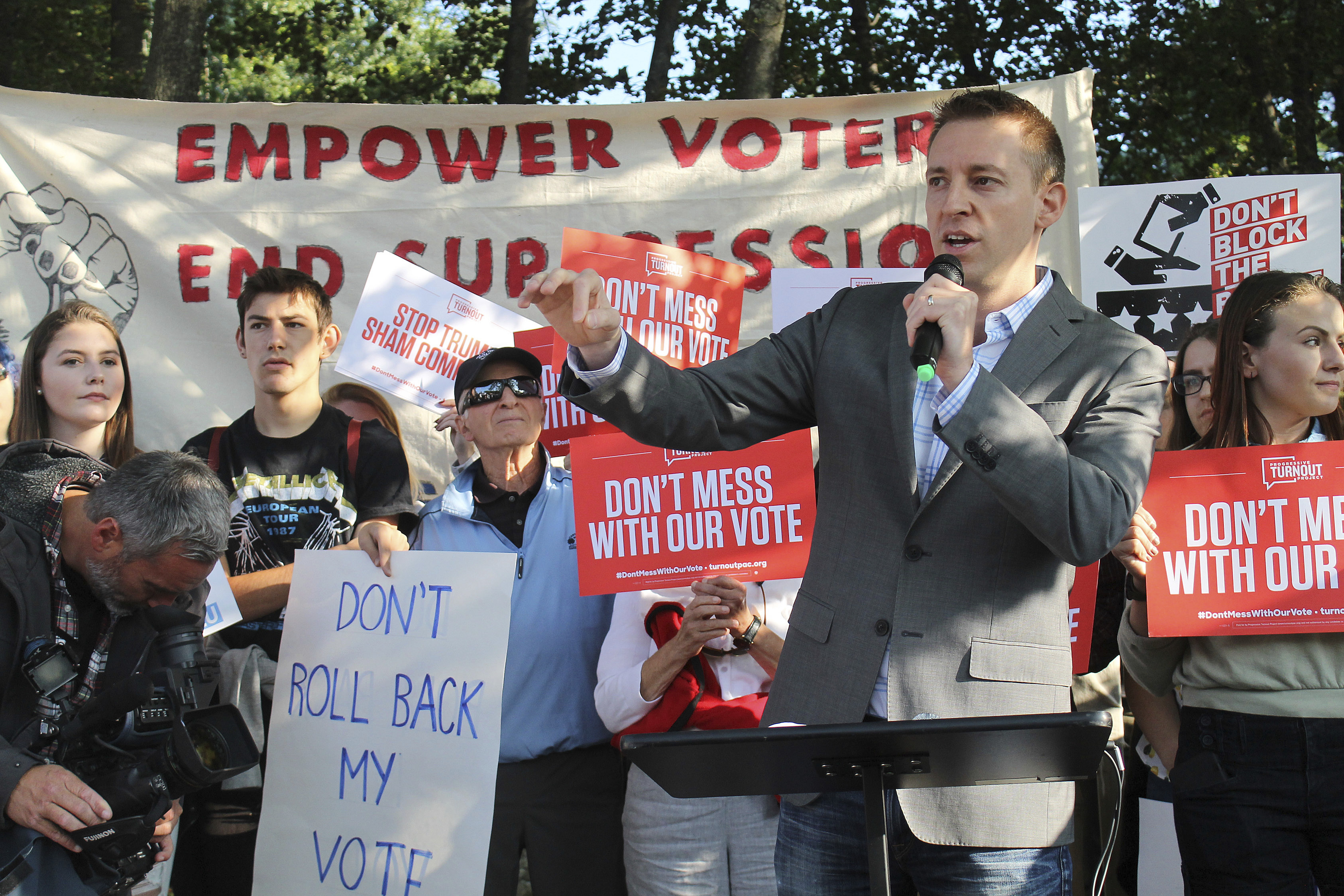 Former Missouri Secretary of State Jason Kander, founder of "Let America Vote" speaks to protesters about the Trump administration's voter fraud commission. (CREDIT: AP Photo/Holly Ramer)