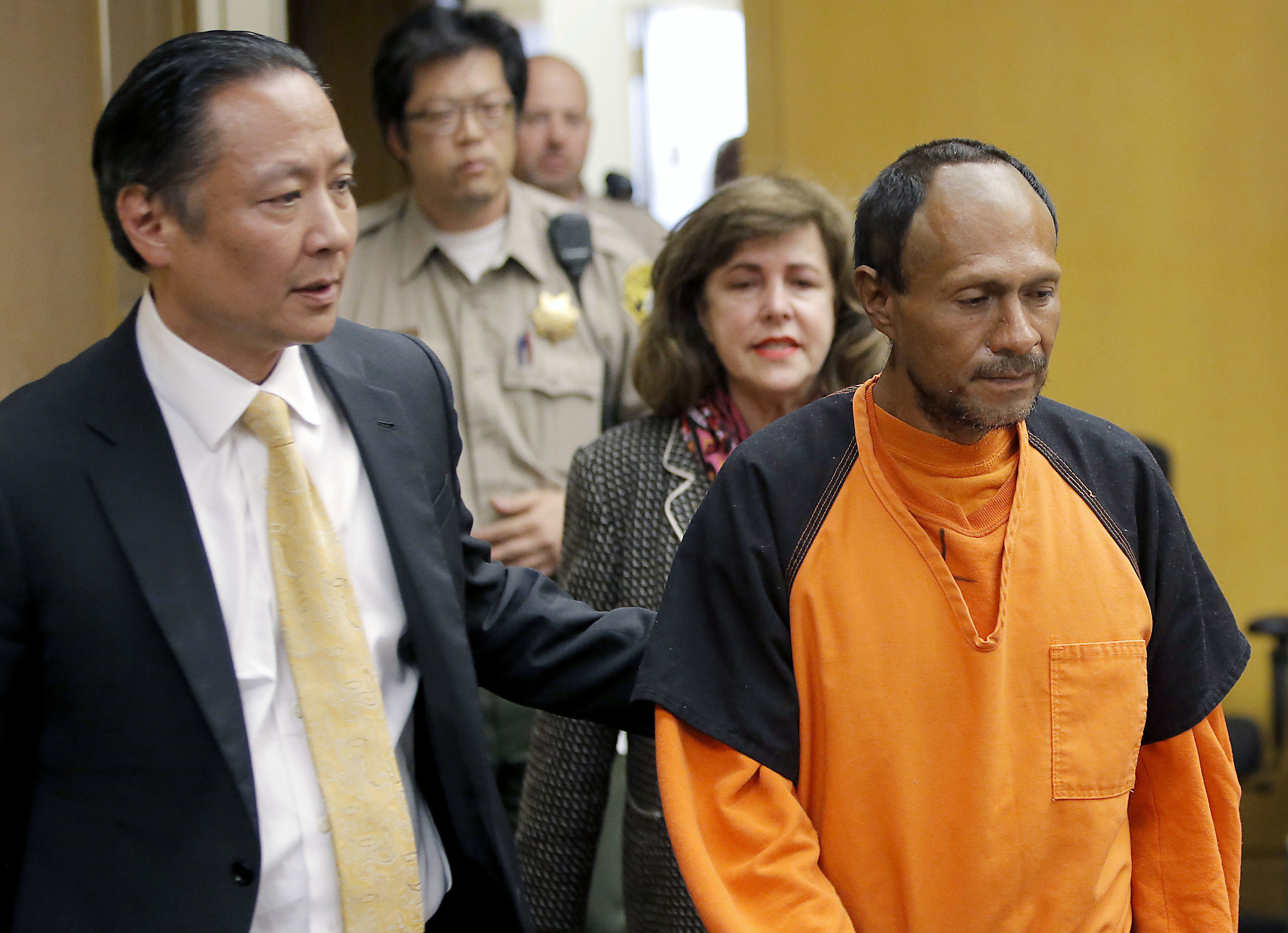 Jose Ines Garcia Zarate, right, is led into the courtroom by San Francisco Public Defender Jeff Adachi, left, and Assistant District Attorney Diana Garciaor, center, for his arraignment at the Hall of Justice in San Francisco, July 7, 2015. (CREDIT: Michael Macor/San Francisco Chronicle via AP, Pool, File)