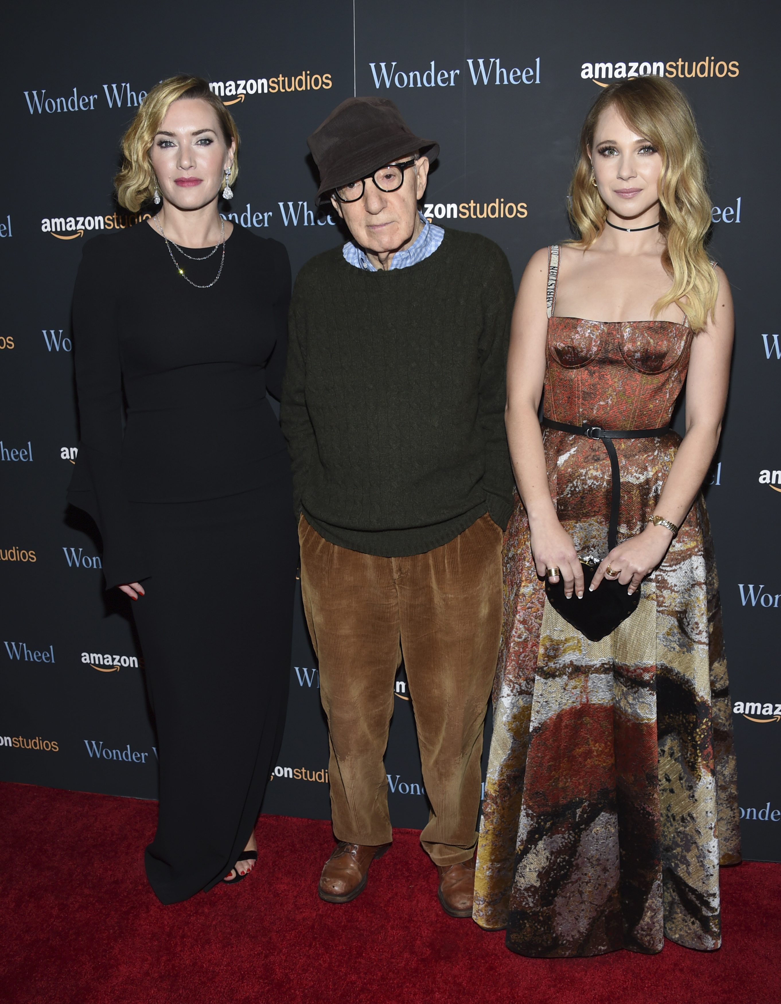 Director Woody Allen, center, poses with actors Kate Winslet, left, and Juno Temple at a special screening of "Wonder Wheel", hosted by Amazon Studios, at the Museum of Modern Art on Tuesday, Nov. 14, 2017, in New York. CREDIT: Evan Agostini/Invision/AP
