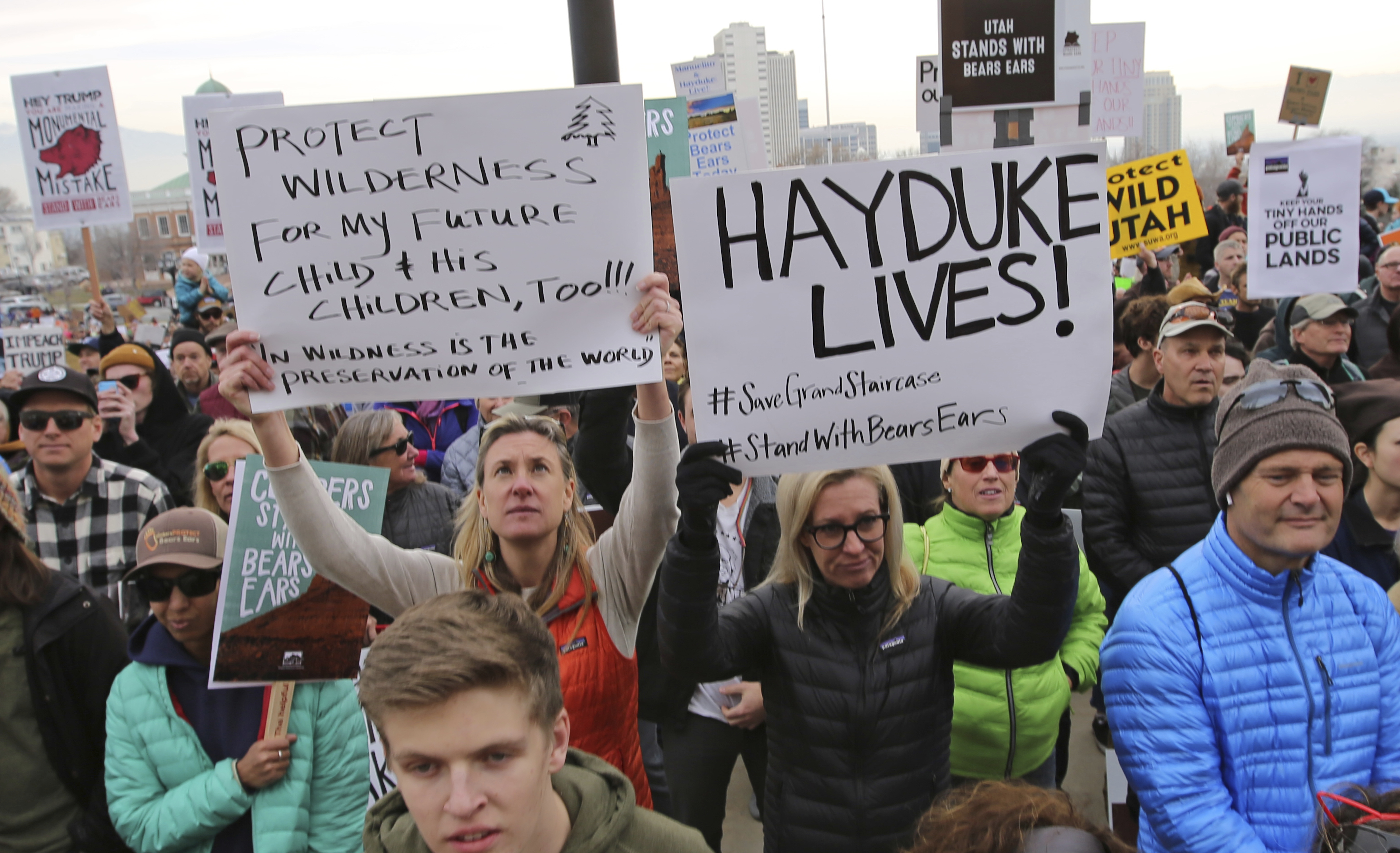 Supporters of the Bears Ears and Grand Staircase-Escalante National Monuments hold signs during a rally Saturday, Dec. 2, 2017, in Salt Lake City. CREDIT: AP Photo/Rick Bowmer