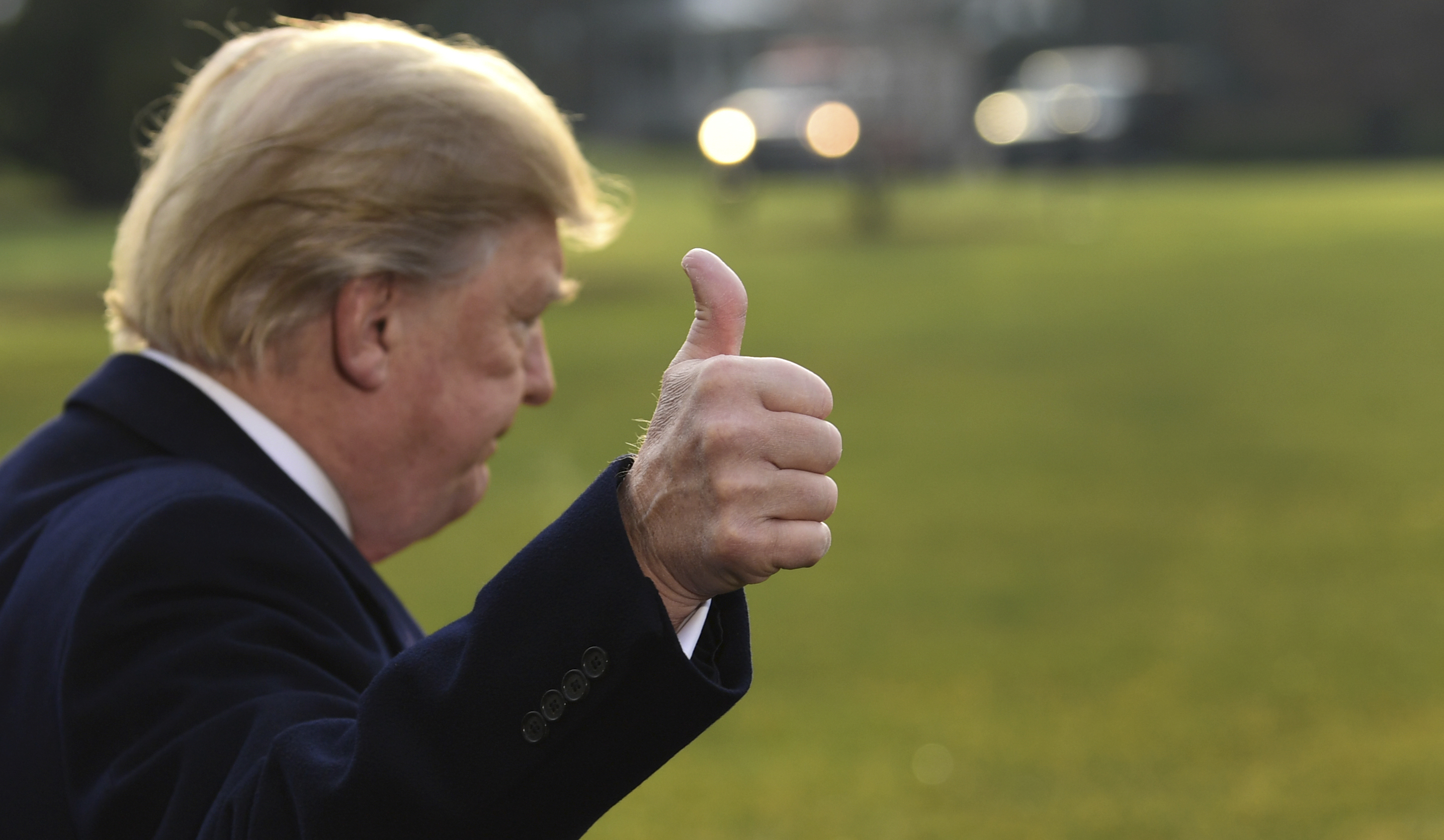 President Donald Trump gives a thumbs up after speaking to reporters before boarding Marine One on the South Lawn of the White House in Washington, Monday, Dec. 4, 2017 (CREDIT: AP Photo/Susan Walsh)