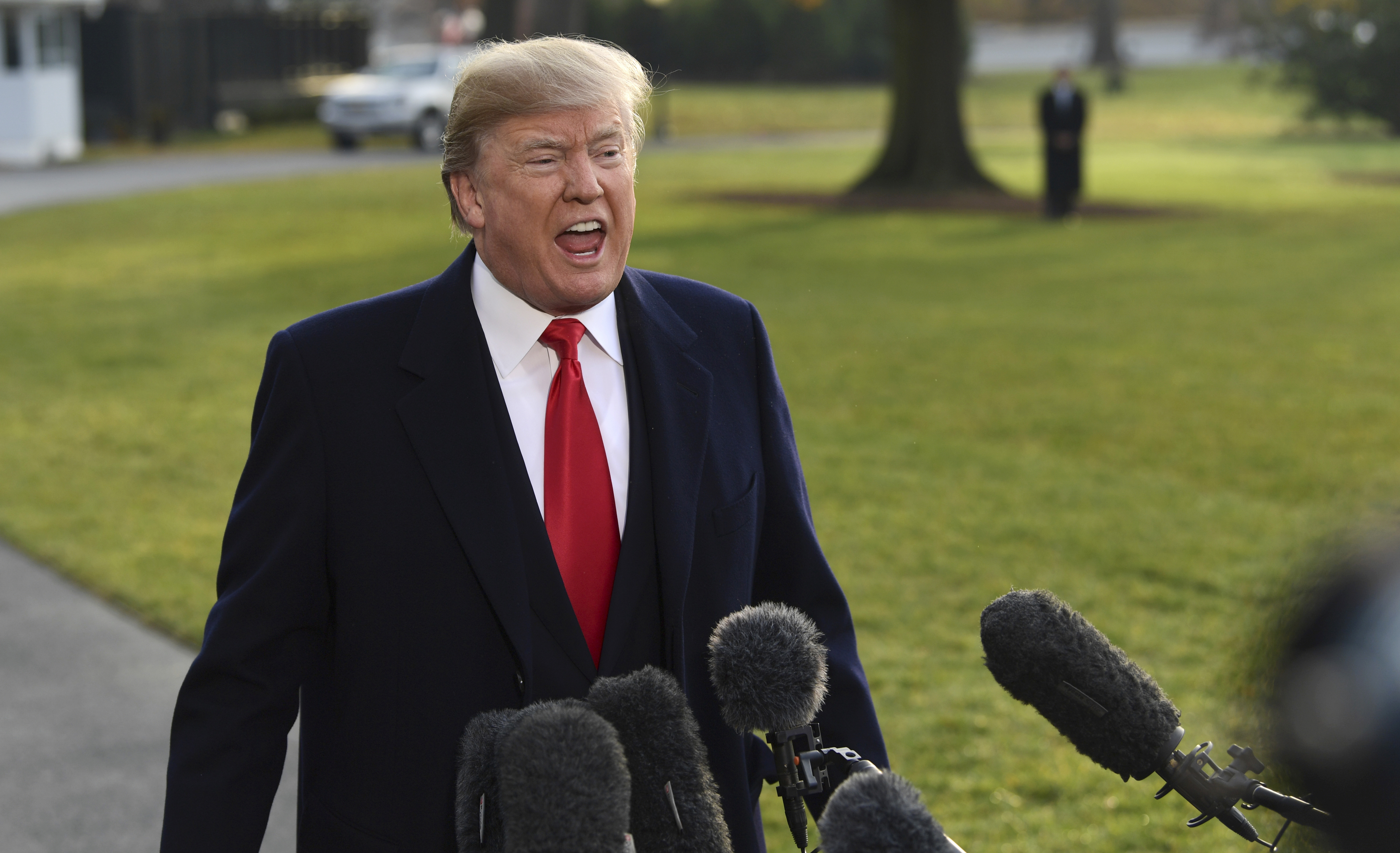 President Donald Trump speaks to reporters before boarding Marine One on the South Lawn of the White House in Washington, Monday (AP Photo/Susan Walsh).