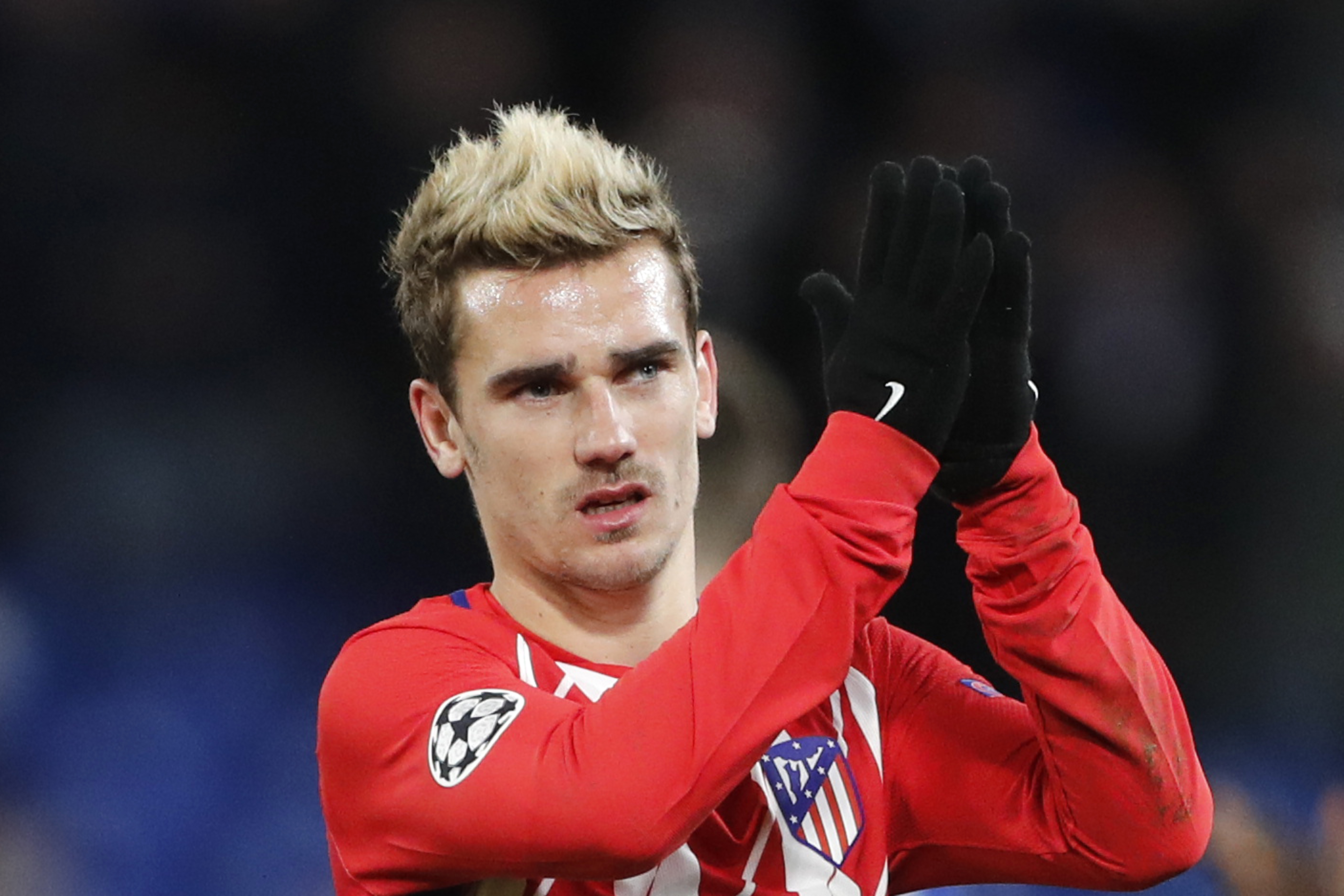 Antoine Griezmann greets fans after the 1-1 draw in the Champions League match between Chelsea and Atletico Madrid in London, Dec. 5, 2017. (CREDIT: AP Photo/Frank Augstein)