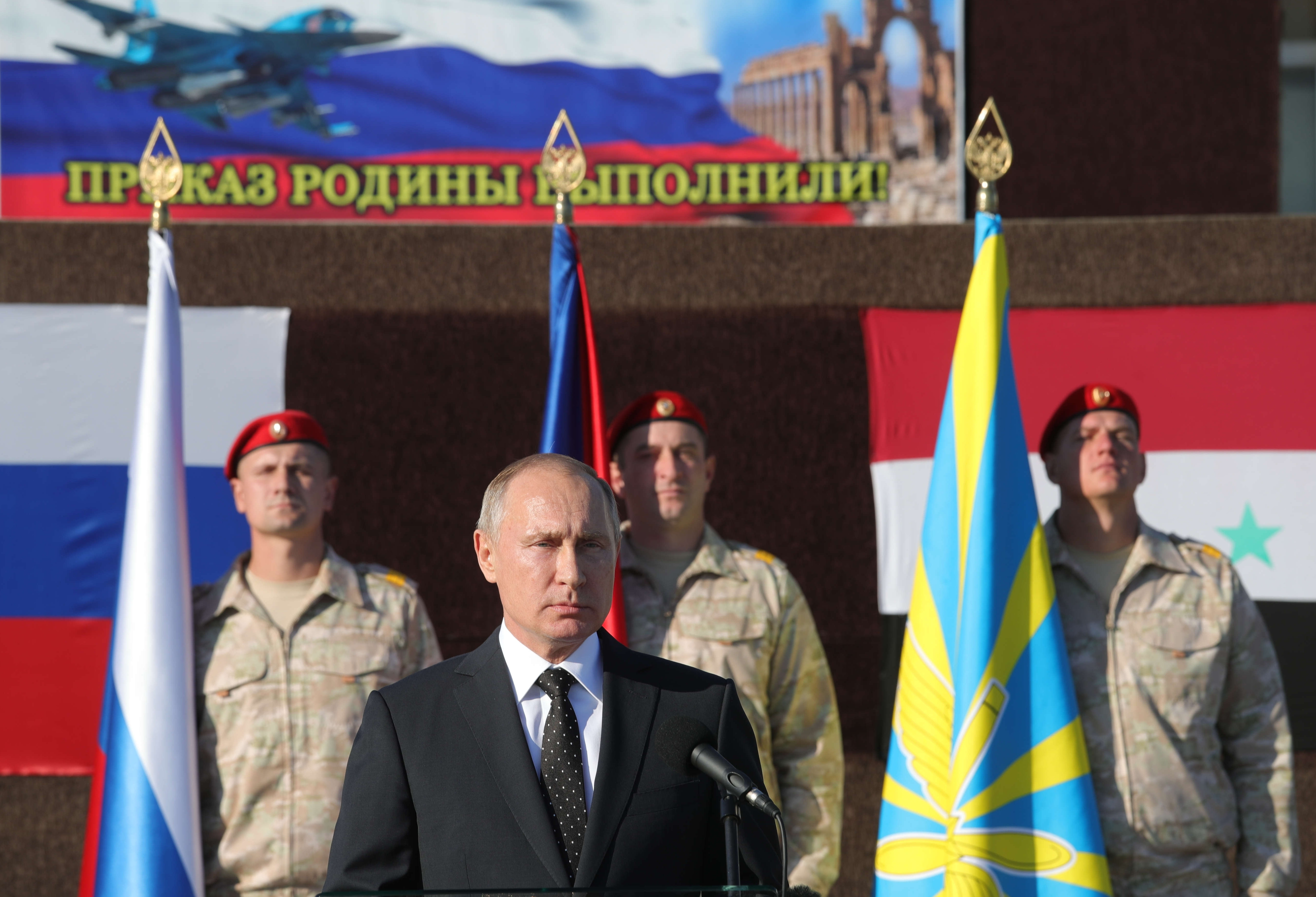 Russian President Vladimir Putin addresses the troops at the Hemeimeem air base in Syria, on Monday, Dec. 11, 2017. (CREDIT: Mikhail Klimentyev/Sputnik via AP Photo.)