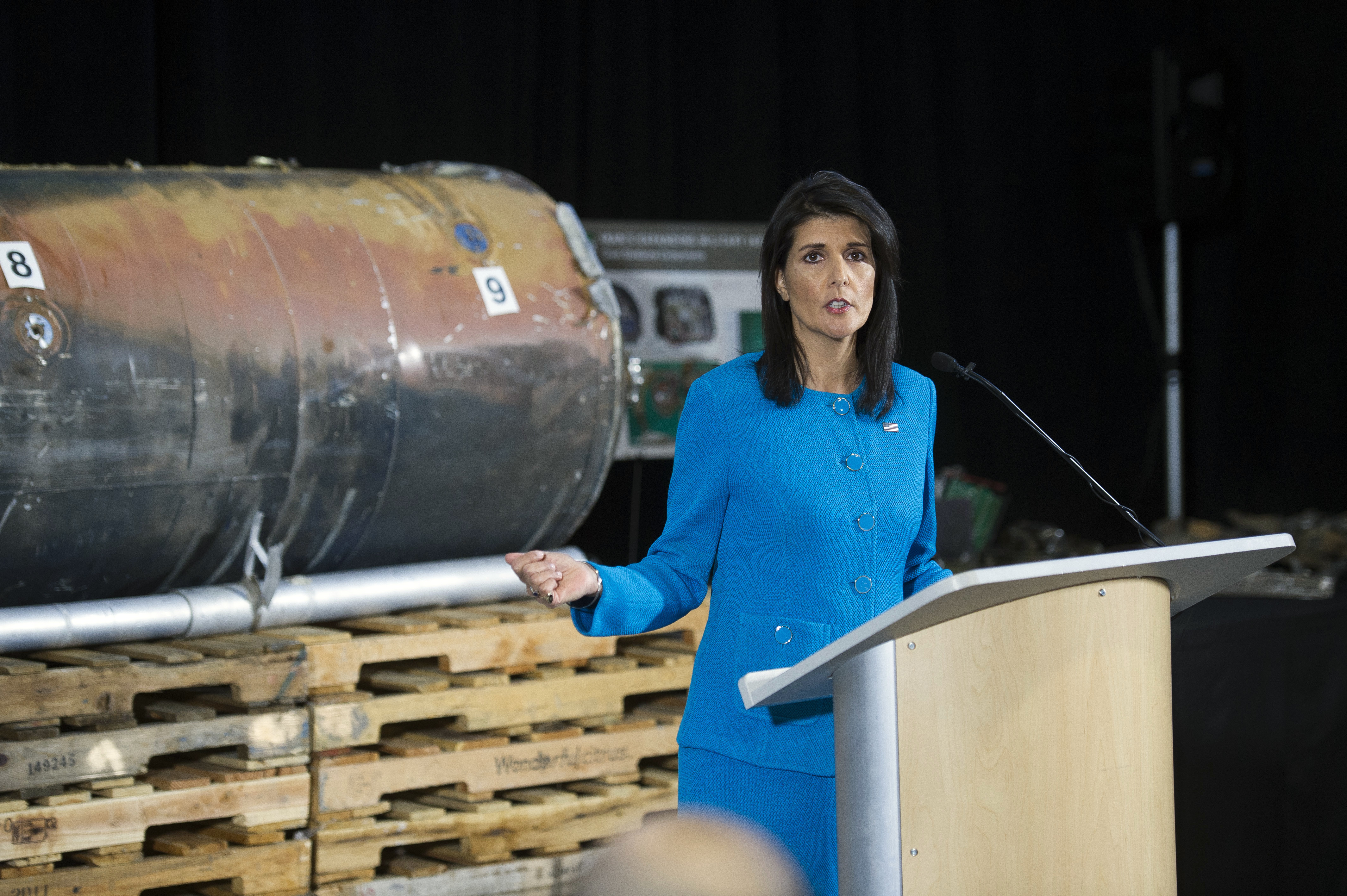 U.S. Ambassador to the U.N. Nikki Haley speaks in front recovered segments of an Iranian rocket during a press briefing at Joint Base Anacostia-Bolling, Thursday, Dec. 14, 2017, in Washington. Haley says "undeniable" evidence proves Iran is violating international law by funneling missiles to Houthi rebels in Yemen. Haley unveiled recently declassified evidence including segments of missiles launched at Saudi Arabia from Houthi-controlled territory in Yemen. CREDIT: Cliff Owen/AP Photo.