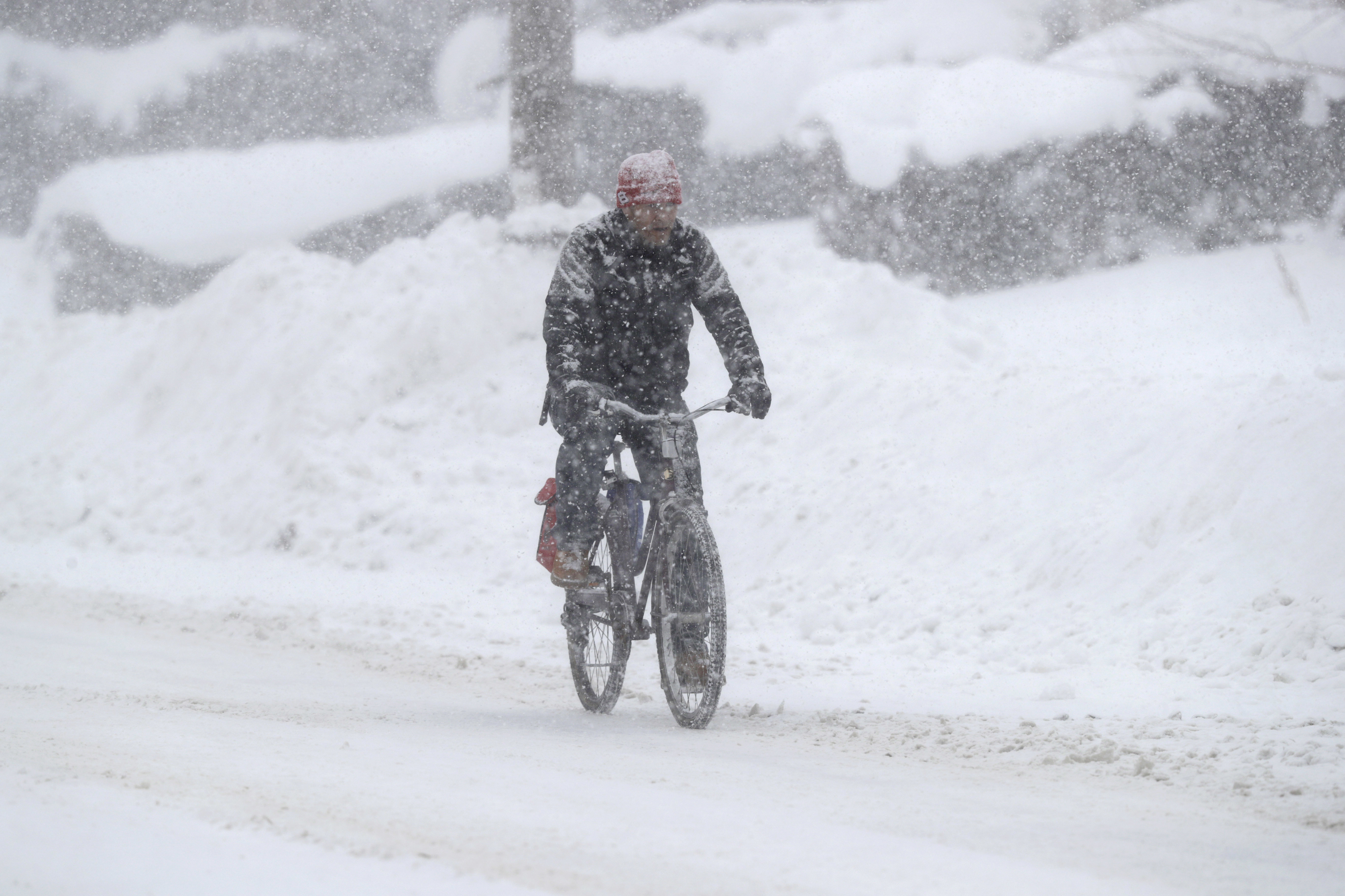 A man rides on his bicycle on Friday, Dec. 29, 2017, in Erie, PA. (CREDIT: AP Photo/Tony Dejak)
