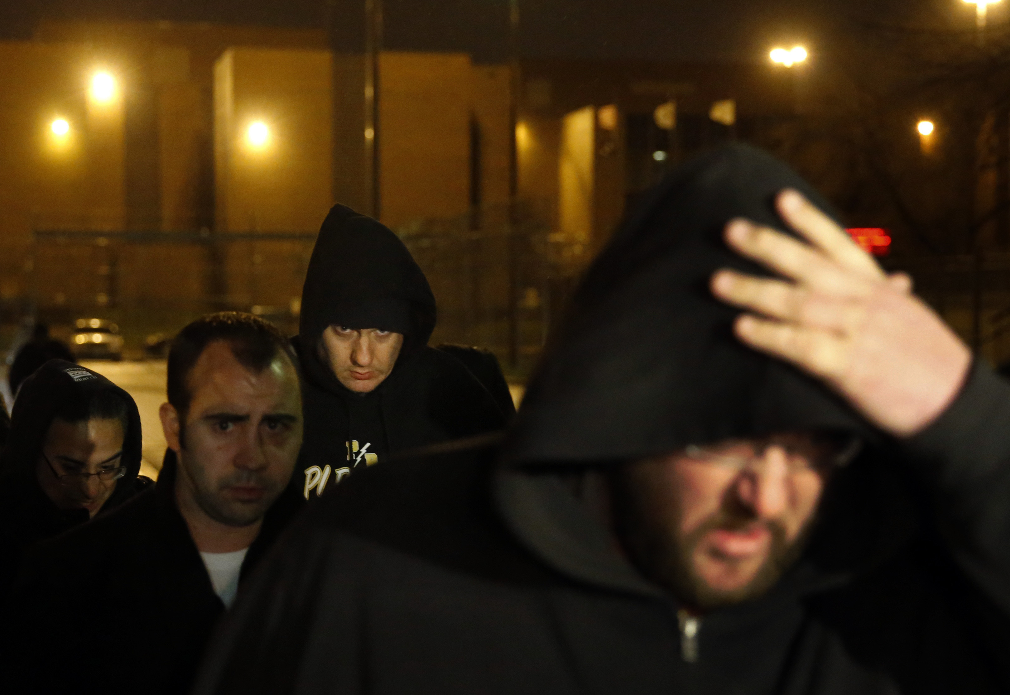 Chicago Police Officer Jason Van Dyke, background center, faces homicide charges for killing Laquan McDonald three years ago. CREDIT: AP Photo/Charles Rex Arbogast