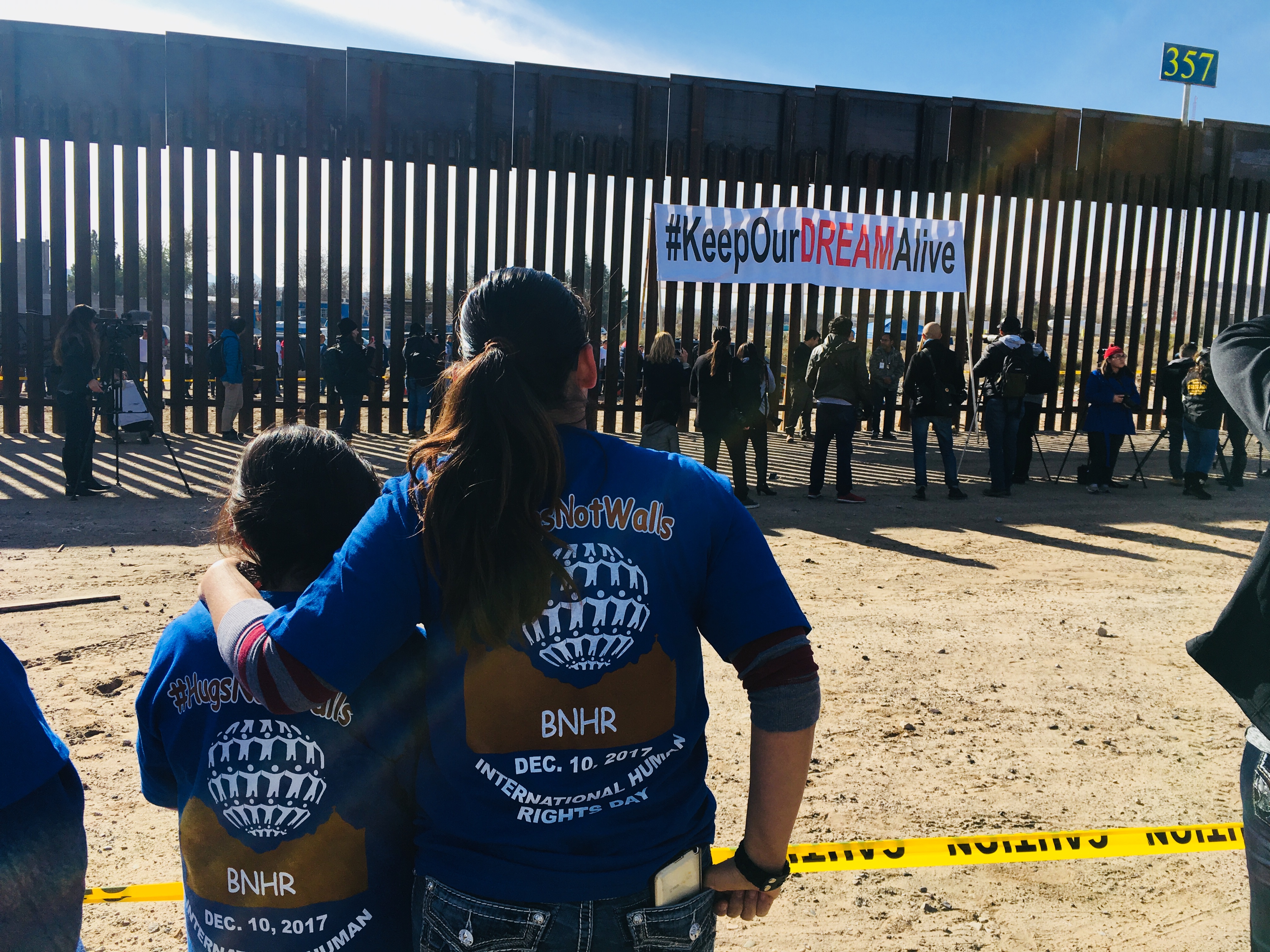 Maribel Gomez (right) and her family came to Sunland Park, New Mexico on December 10, 2017 to participate in the "Keep our dream alive" event to meet with relatives on the Mexican side of the border wall. (CREDIT: Esther Y. Lee)