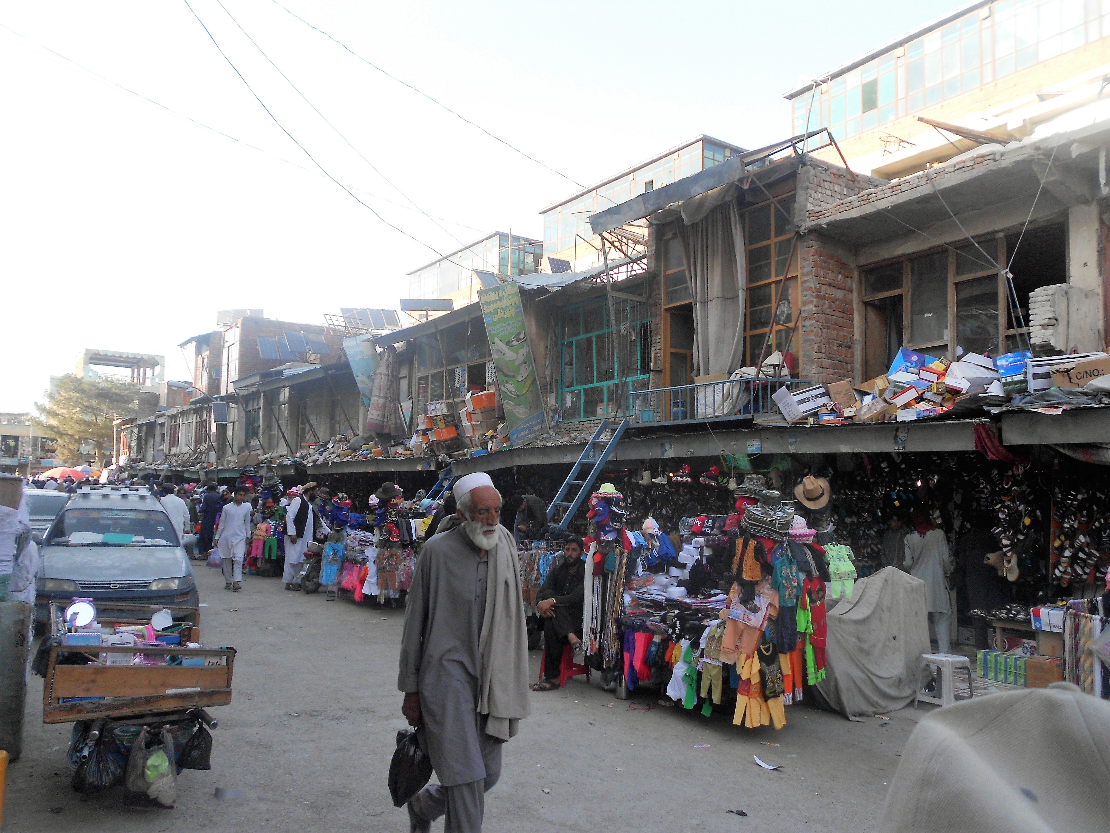 A local walks on a busy street in Khost. (CREDIT: Emran Feroz)