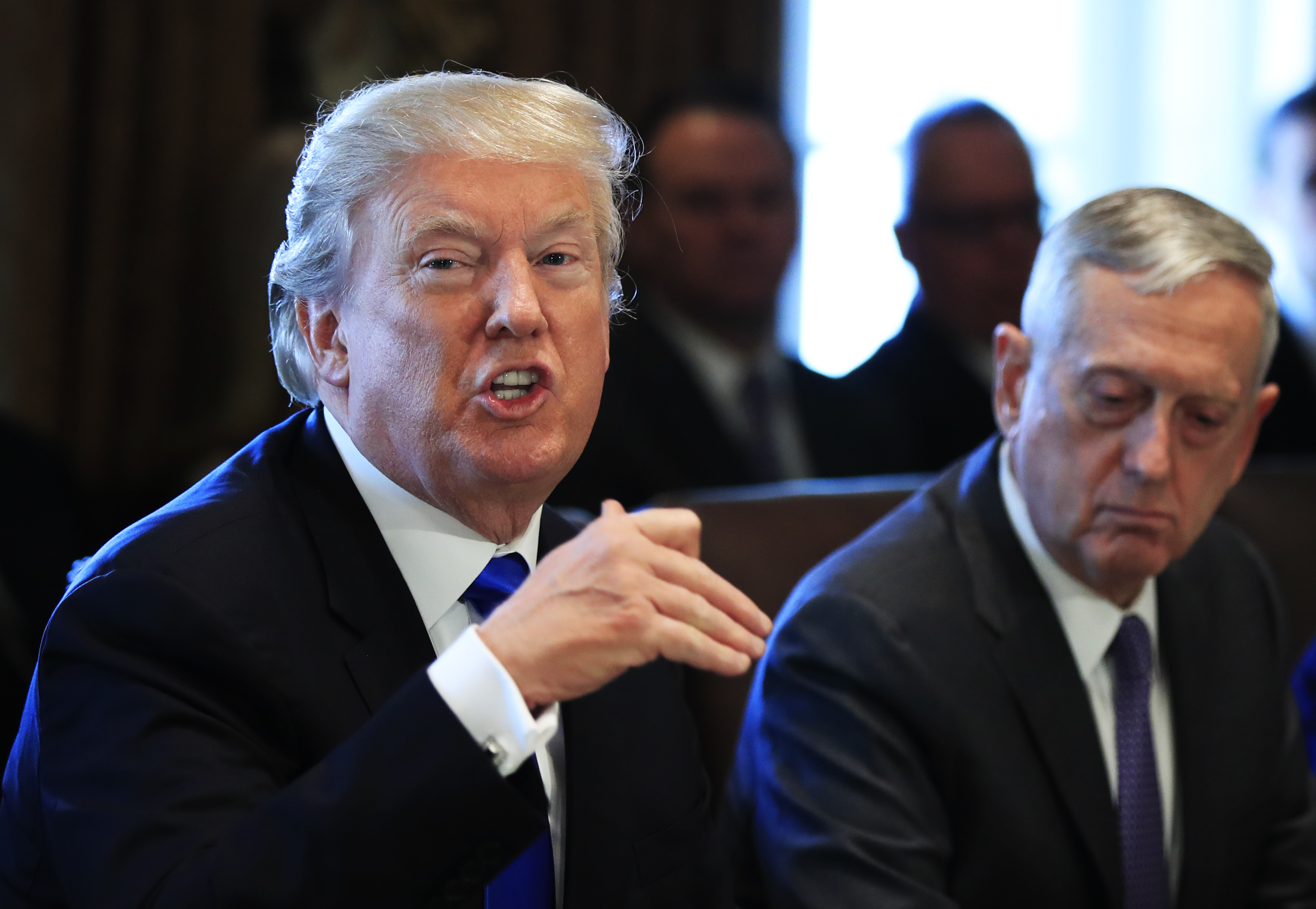 Secretary of Defense Jim Mattis, right, has stated that climate change is real and a threat to the military’s assets and activities. CREDIT: AP Photo/Manuel Balce Ceneta
