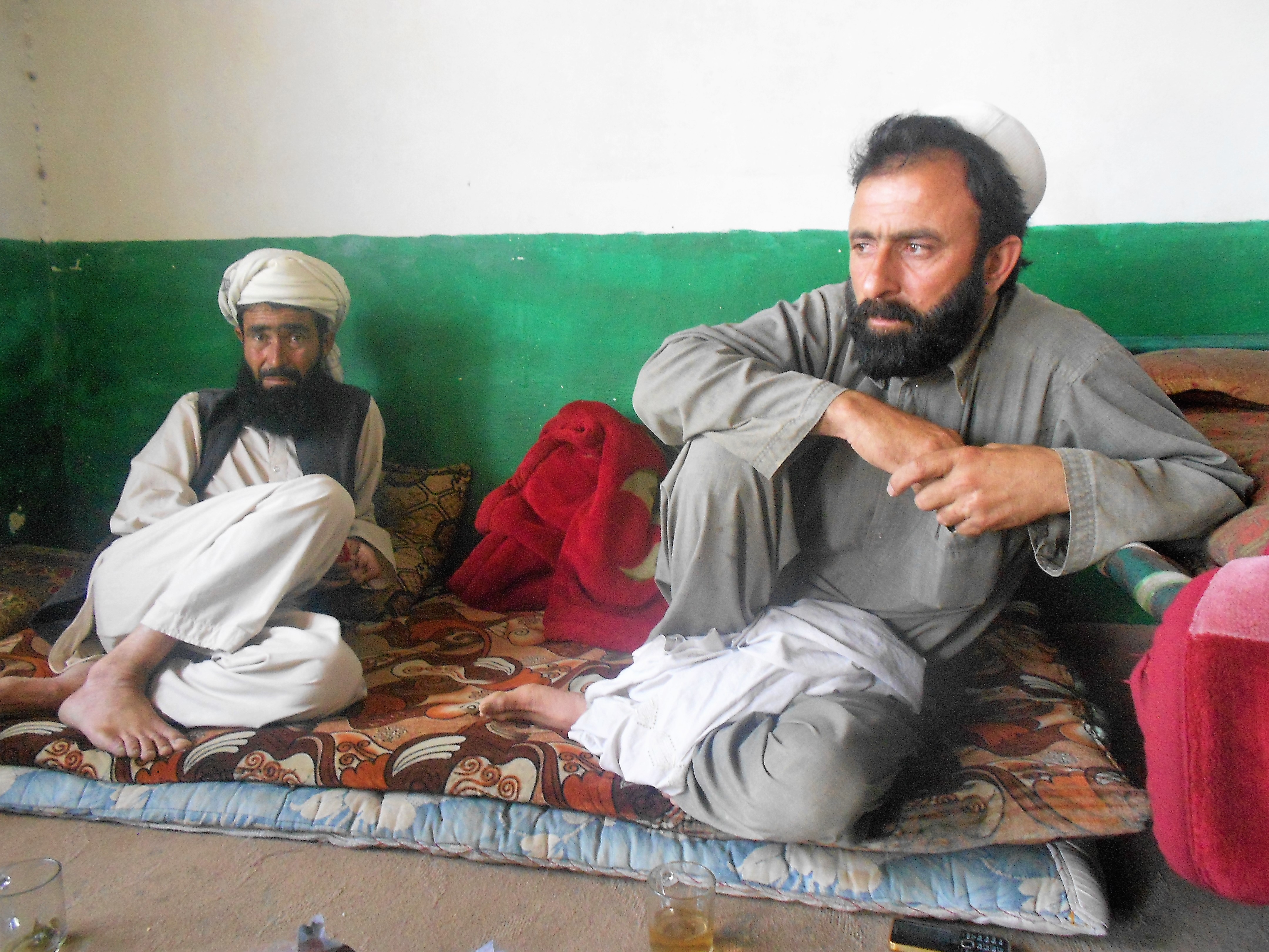 Pasta Khan (left) and Nura Jan (right) discuss the impact of drones on their lives. (CREDIT: Emran Feroz)