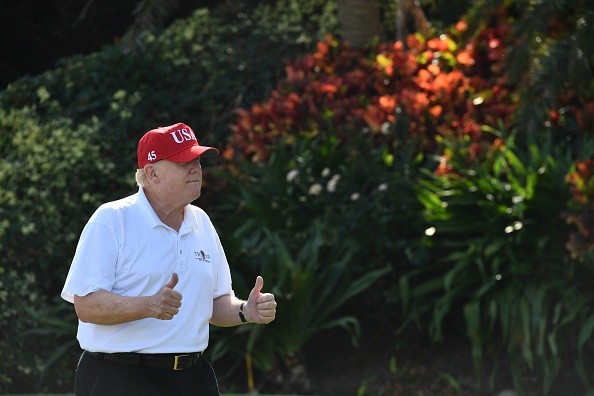US President Donald Trump holds two thumbs up while meeting with service members of the United States Coast Guard to play golf at Trump International Golf Course in Mar-a-Lago, Florida on December 29, 2017.
(NICHOLAS KAMM/AFP/Getty Images)