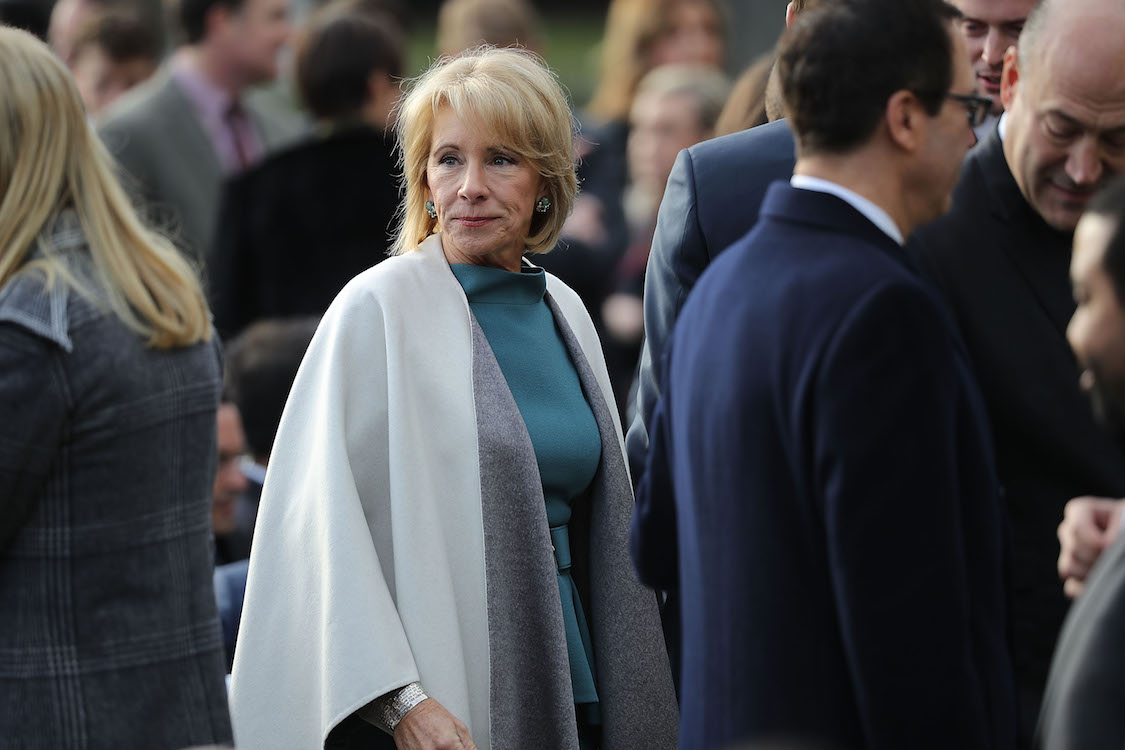 Education Secretary Betsy DeVos attends an event to celebrate Congress passing the Tax Cuts and Jobs Act. CREDIT: Chip Somodevilla/Getty Images)