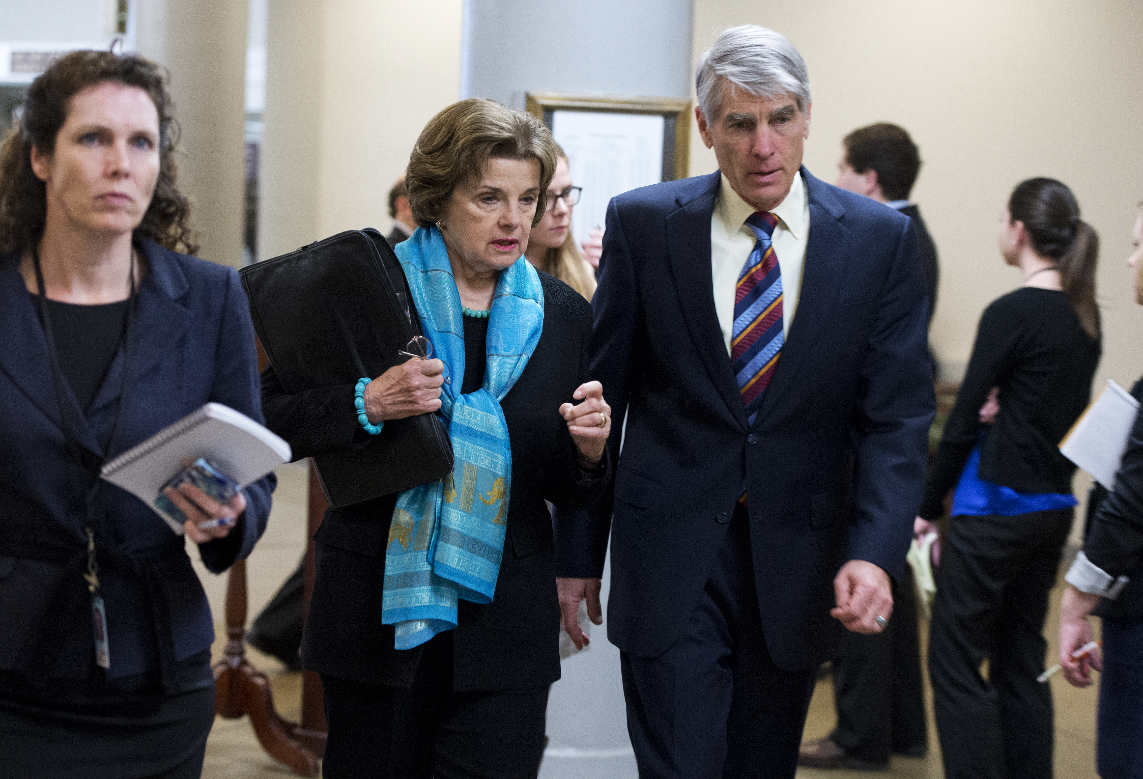 Former Sen. Mark Udall (D-Colo.), right, and Sen. Dianne Feinstein (D-Calif.) make their way to a vote in the Capitol in this file photo. CREDIT: Tom Williams/CQ Roll Call