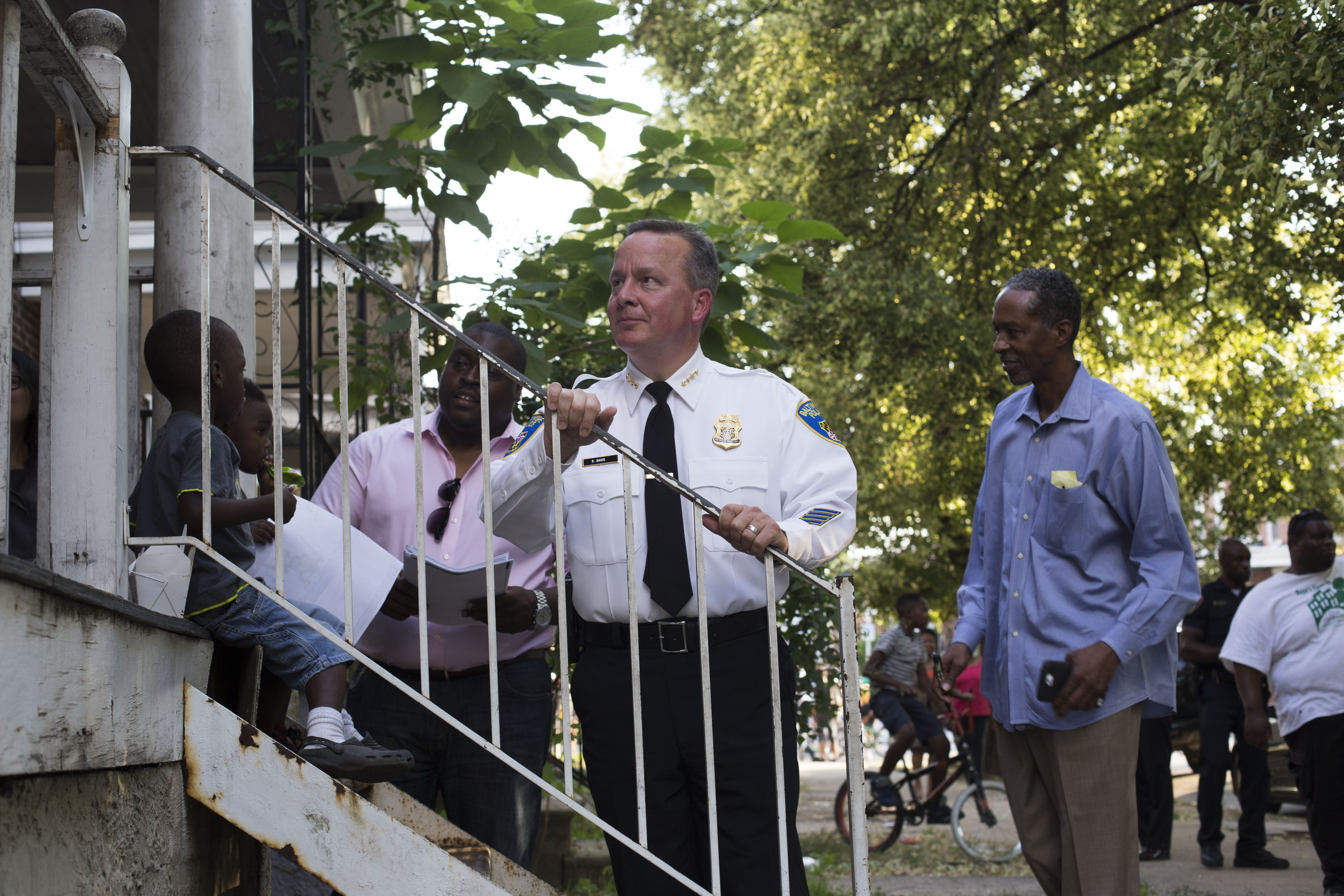 Kevin Davis, pictured here talking to Baltimore residents in 2015, was fired Friday as Commissioner of the Baltimore Police Department. CREDIT: Brittany Greeson/The Washington Post via Getty Images