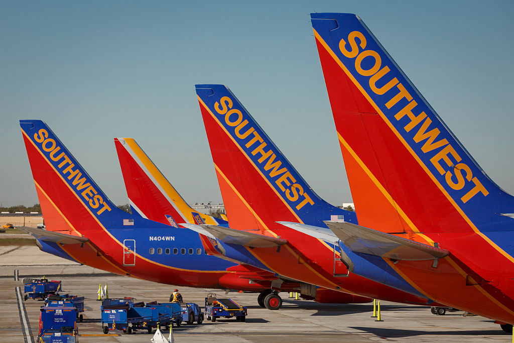Southwest Airlines Boeing 737 planes prepare for takeoff at William P. Hobby international airport in Houston, Texas. (CREDIT: John Gress/Corbis via Getty Images)