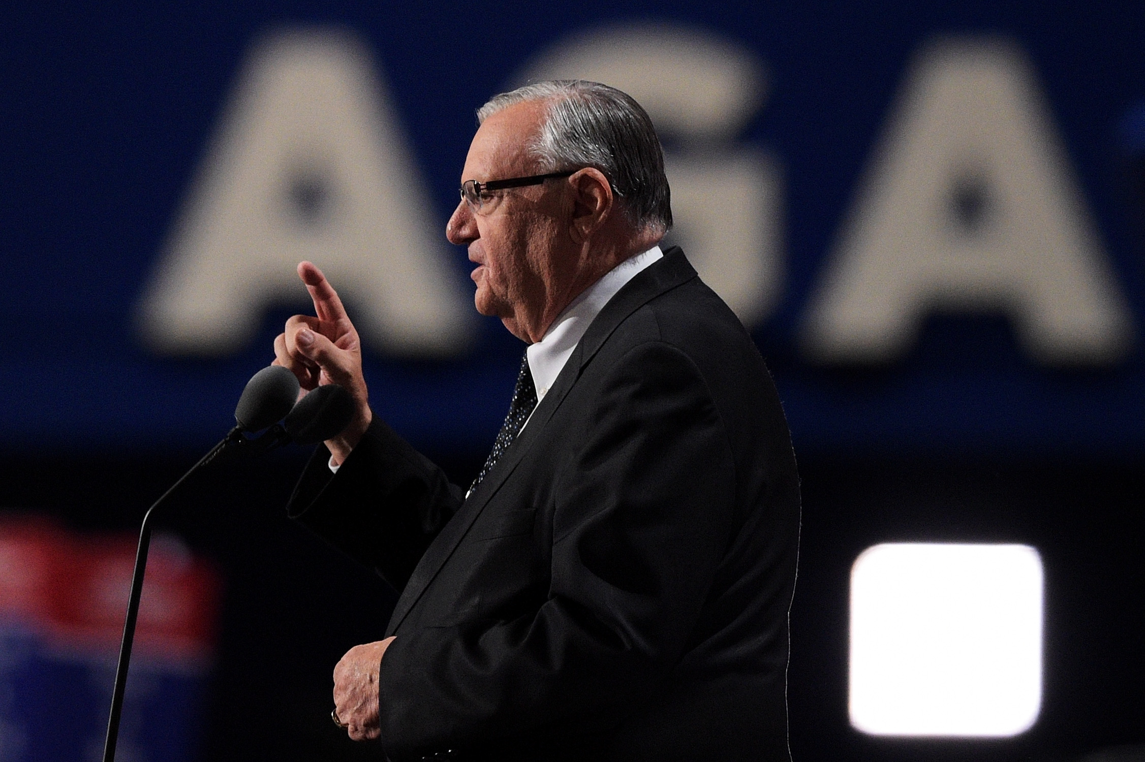 Maricopa County Sheriff Joe Arpaio gestures to the crowd while delivering a speech on the fourth day of the Republican National Convention on July 21, 2016 at the Quicken Loans Arena in Cleveland, Ohio. CREDIT: Photo by Jeff Swensen/Getty Images