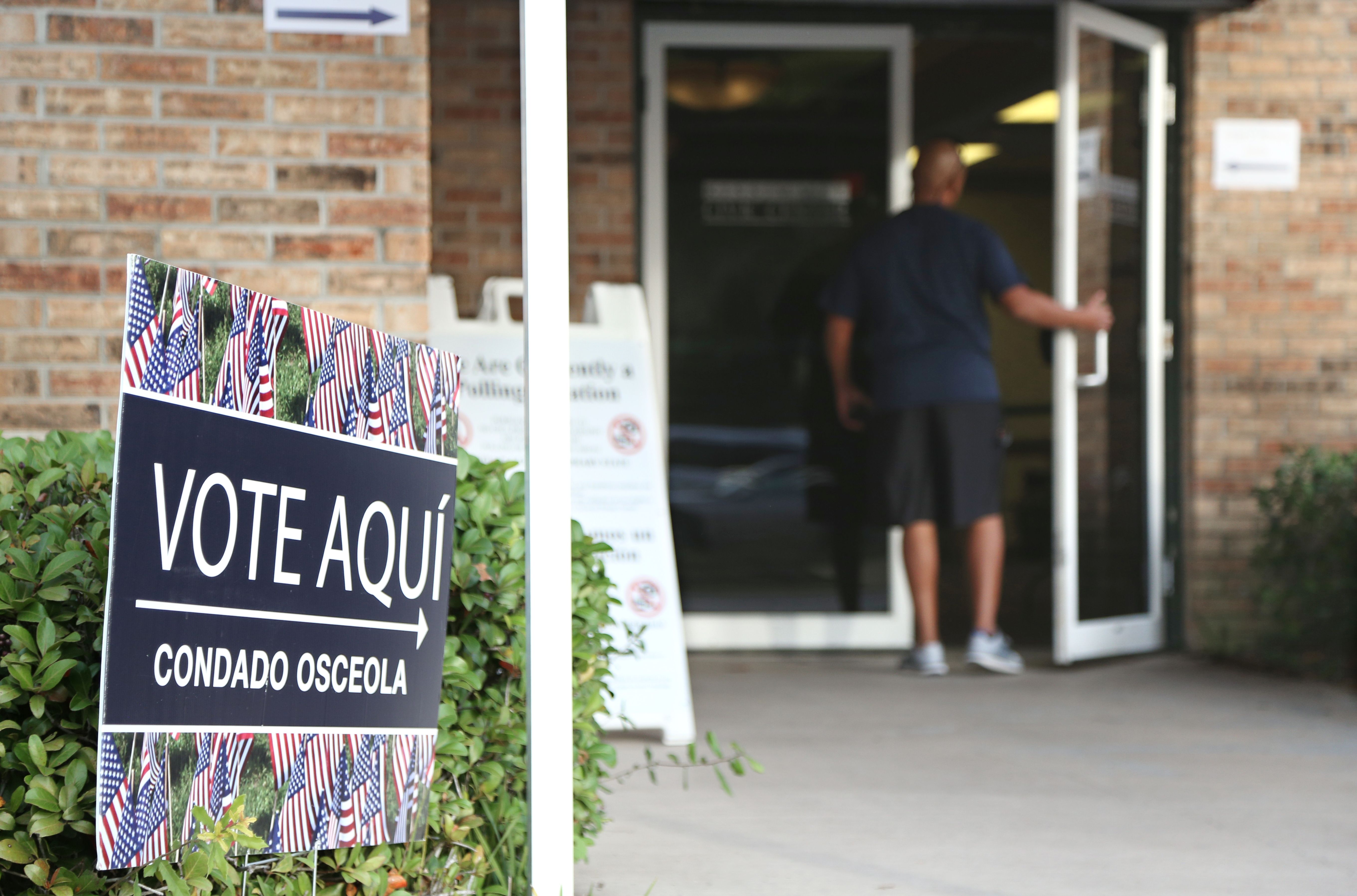 A voter enters an Osceola County polling station during early voting in the federal election in Kissimee, Florida on October 25, 2016. CREDIT: GREGG NEWTON/AFP/Getty Images