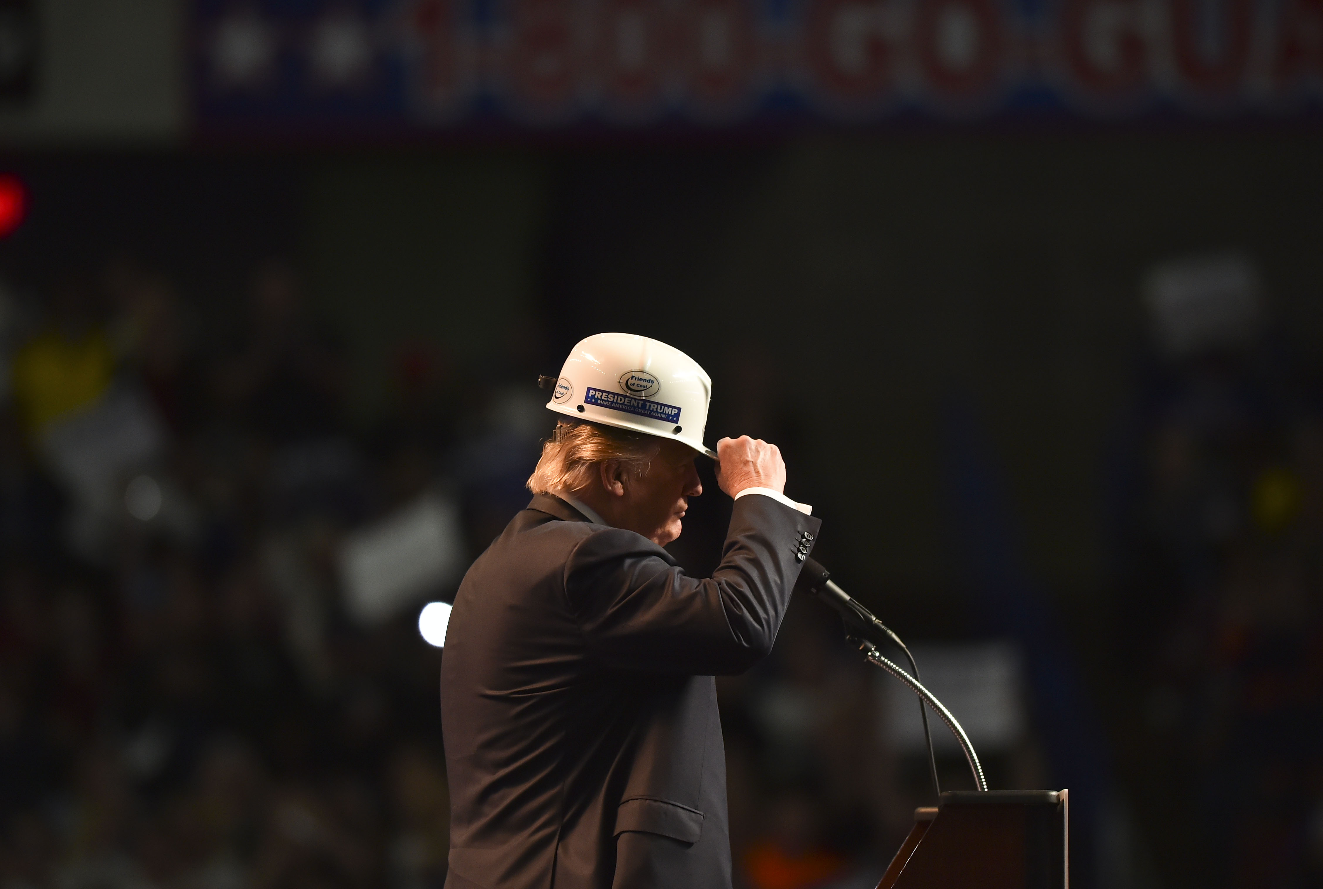 Then-presidential candidate Donald Trump wears a coal miner's protective hat while addressing his supporters during a rally in Charleston, WV. (CREDIT: Ricky Carioti/The Washington Post via Getty Images)