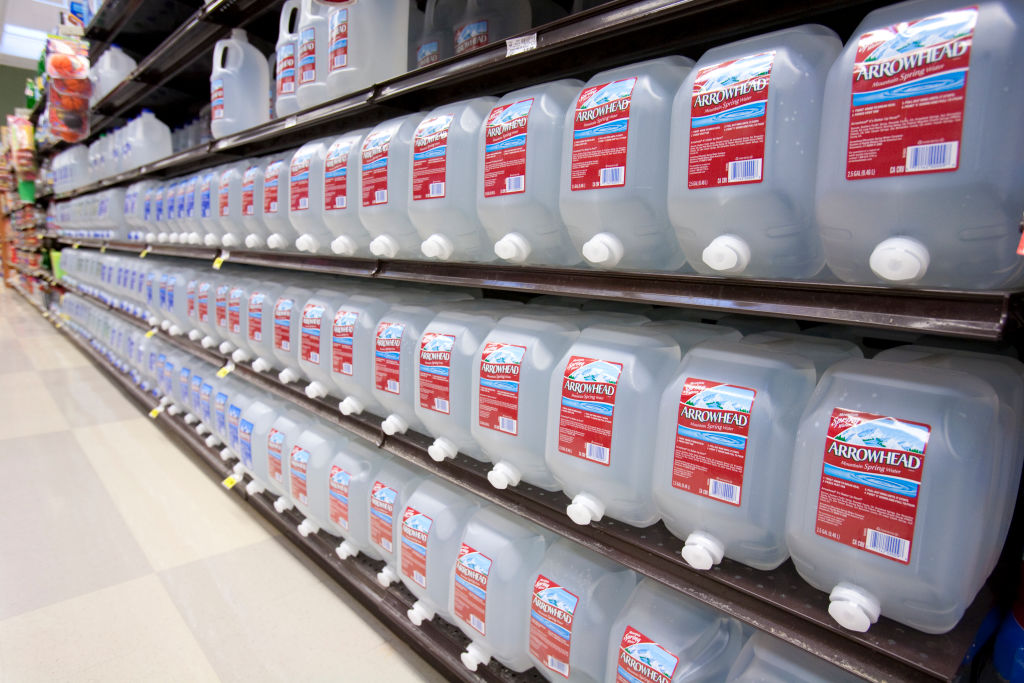 RESIDENTS HAVE RELIED ON BOTTLED WATER FOR YEARS. CREDIT: EDUCATION IMAGES/CITIZENS OF THE PLANET/UIG/GETTY IMAGES