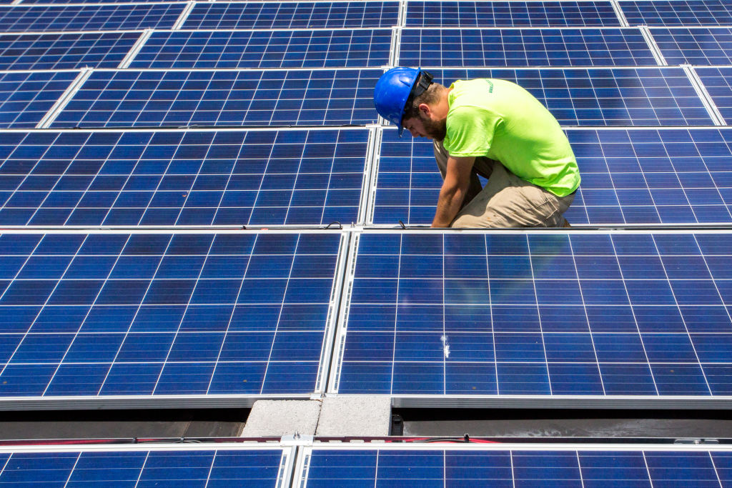 Solar panel installer in North Carolina. CREDIT: Logan Cyrus/Washington Post via Getty Images