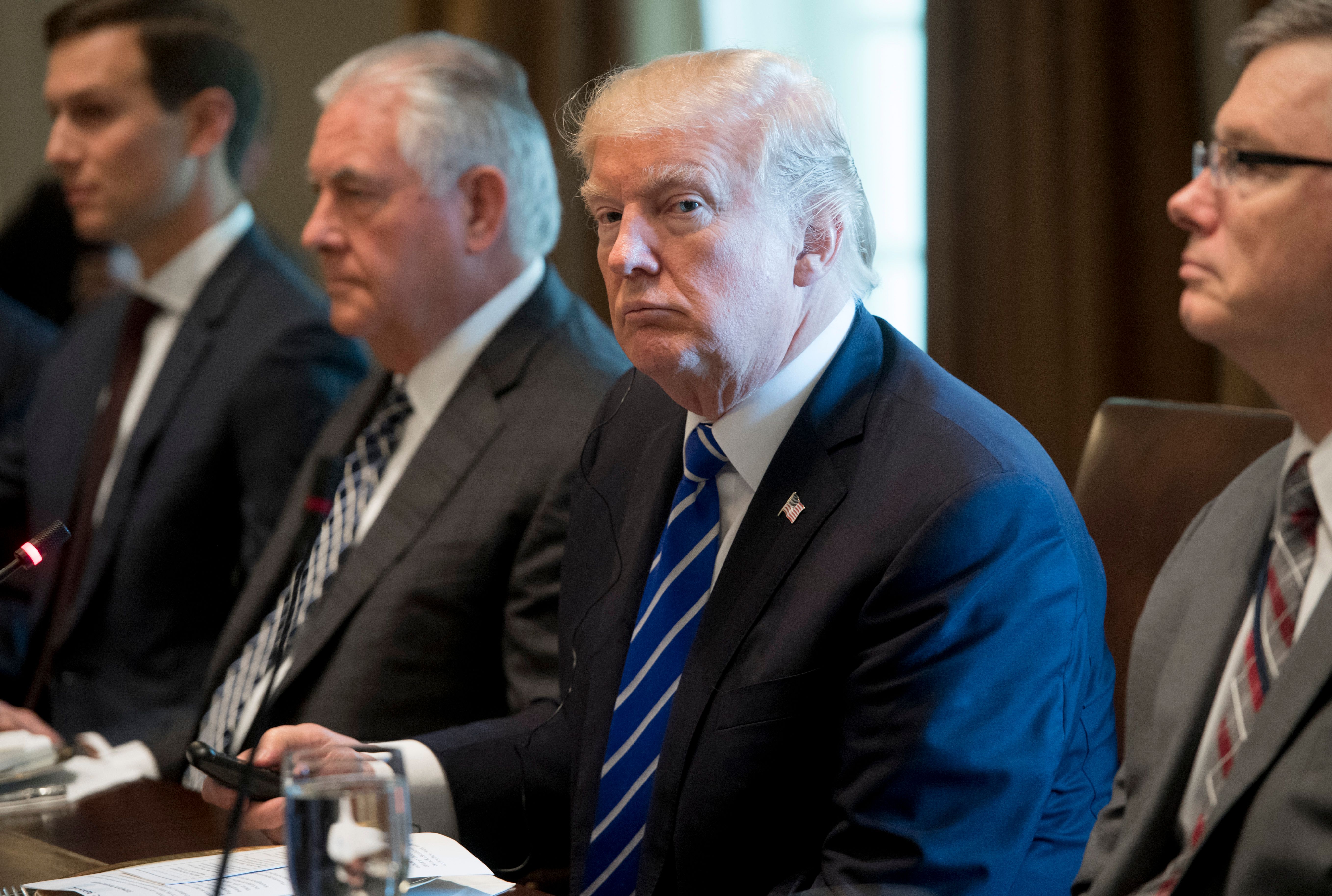 US President Donald Trump sits alongside US Secretary of State Rex Tillerson (2nd L) and Senior Adviser Jared Kushner (L) during a working lunch with Spanish Prime Minister Mariano Rajoy in the Cabinet Room of the White House in Washington, DC. CREDIT: Saul Loeg/AFP/Getty Images.