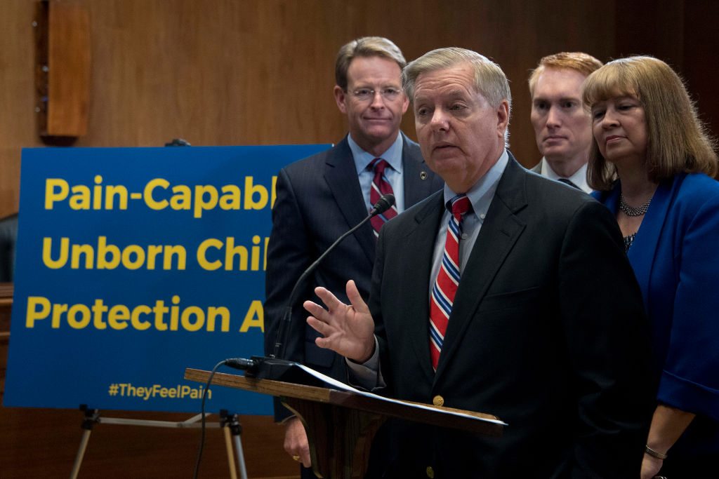 US Senator Lindsey Graham (C), R-SC, introduces the Senate version of a bill that bans abortions after 20 weeks, which passed the House on Tuesday, on Capitol Hill in Washington, DC, October 5, 2017. CREDIT: JIM WATSON/AFP/Getty Images