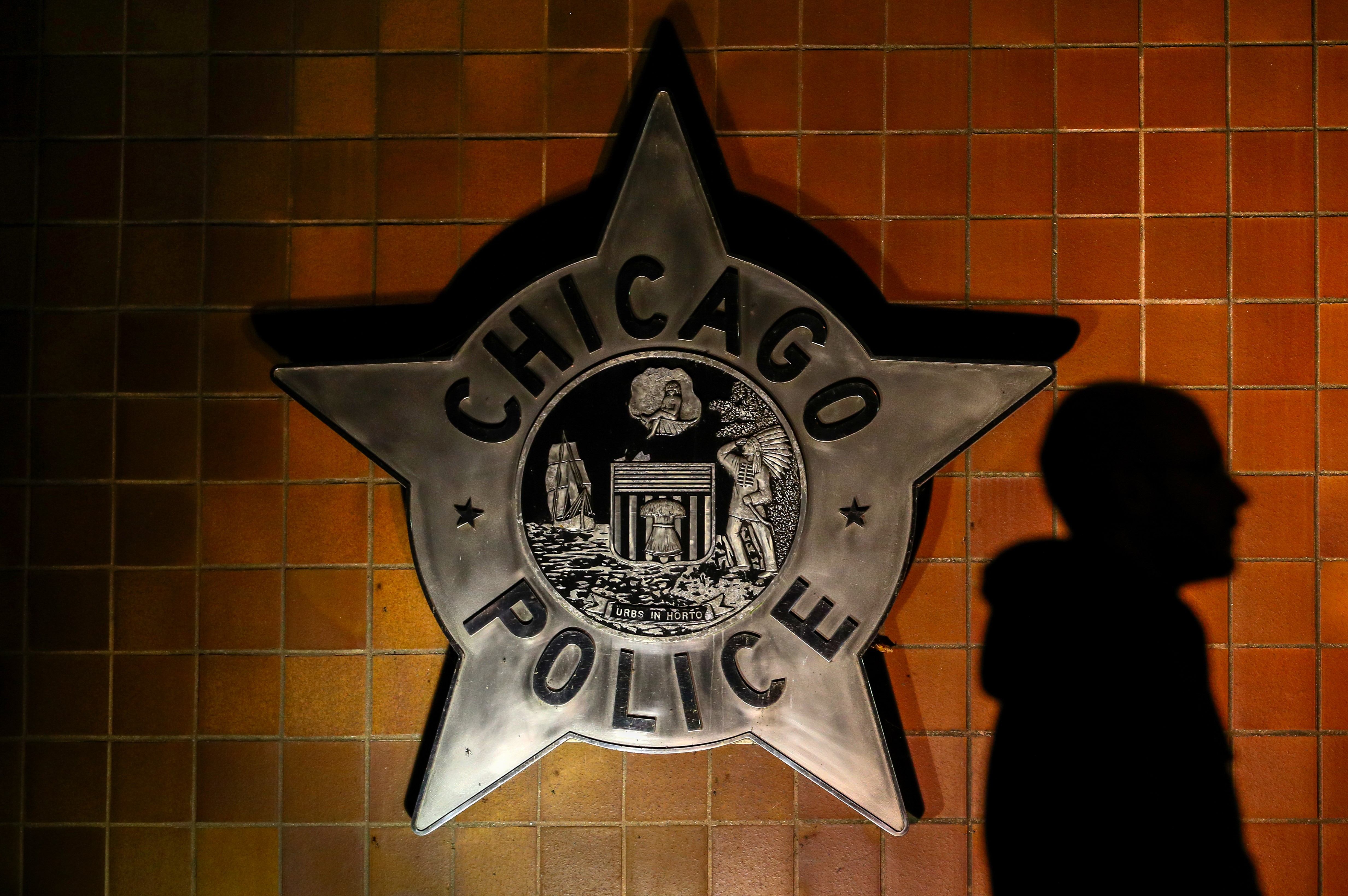 People gather in front of the Chicago Police Department where they stage a demonstration , on October 20, 2017, in memory of the shooting of 17-year-old Laquan McDonald by Chicago police. (CREDIT: Bilgin S. Sasmaz/Anadolu Agency/Getty Images)