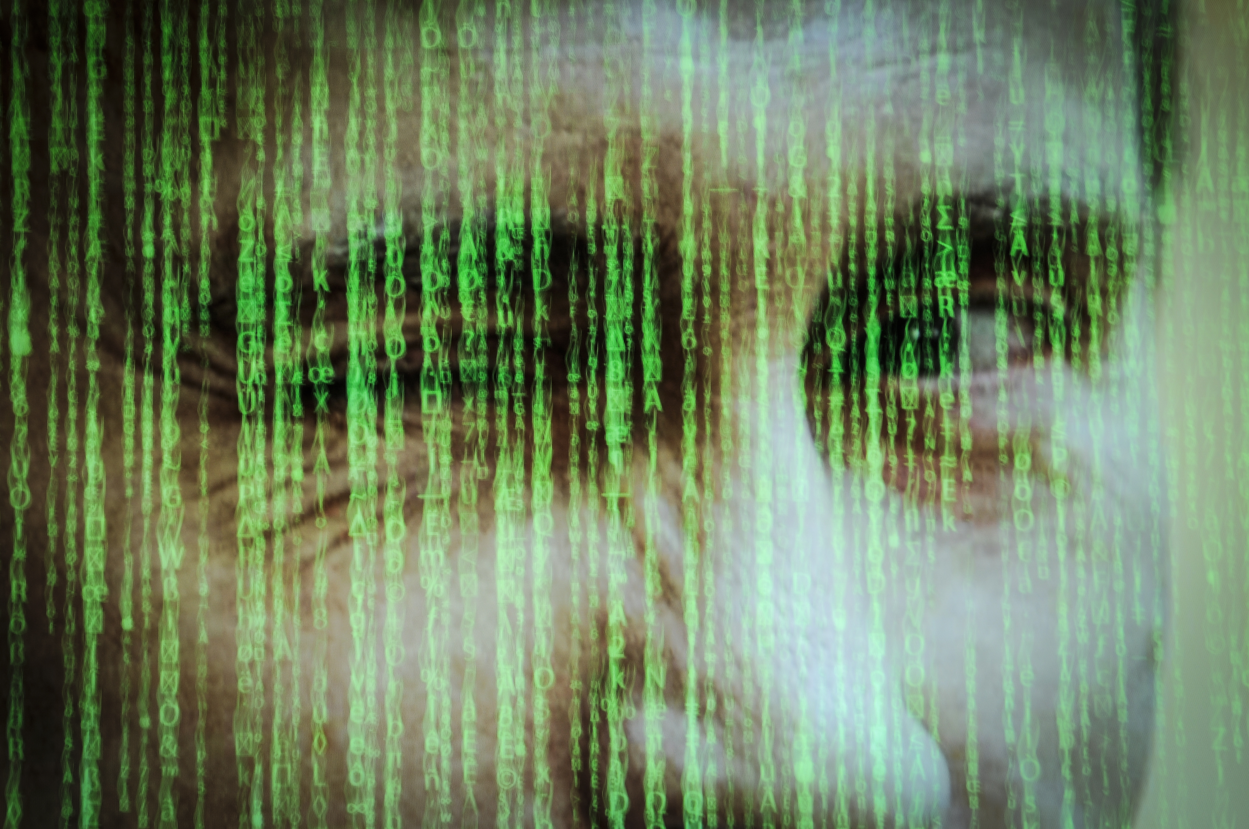 Computer code is seen with a portrait of Russian president Vladimir Putin in this photo illustration on October 31, 2017. CREDIT: Jaap Arriens/NurPhoto via Getty Images