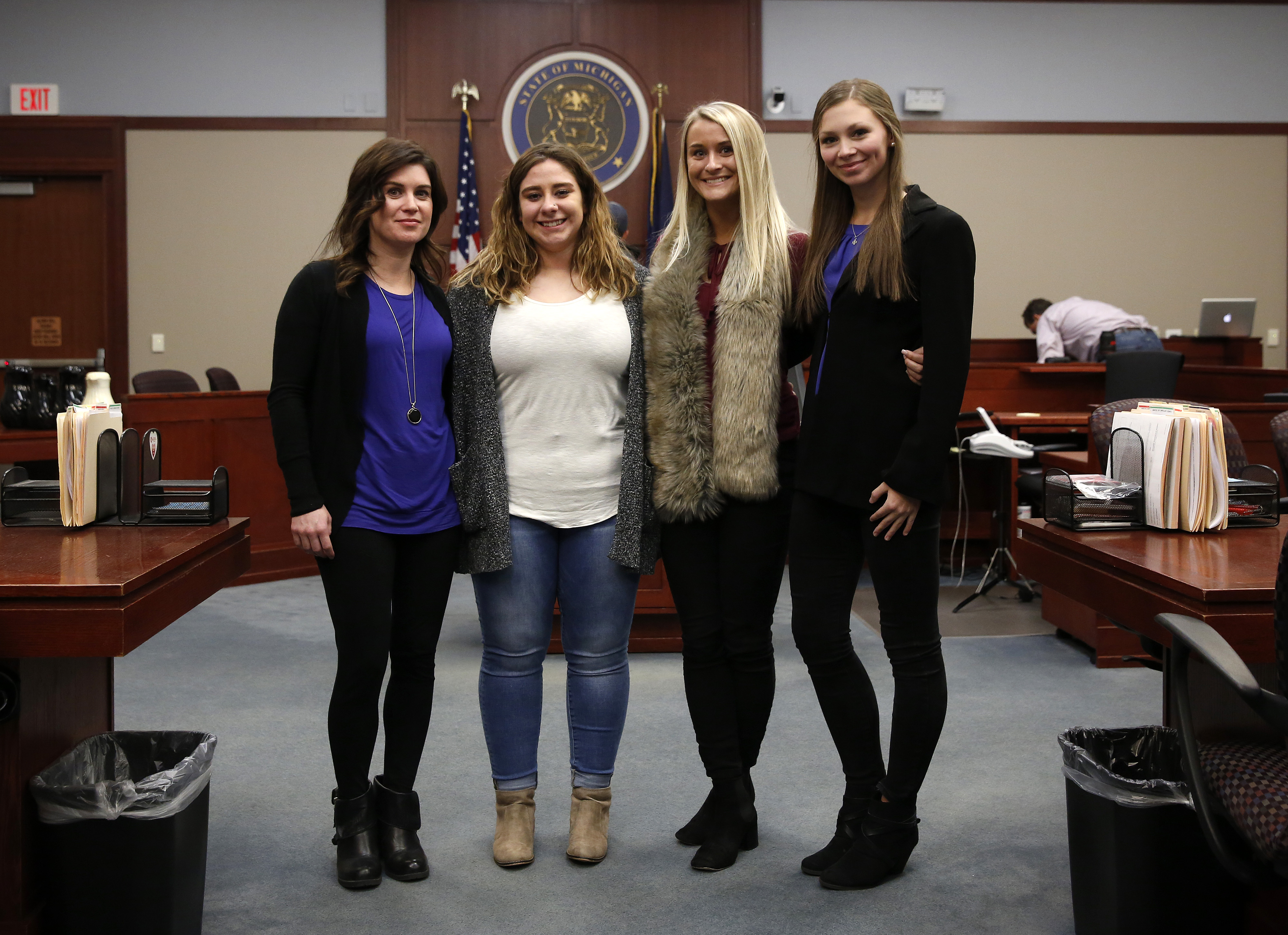 Larissa Boyce (L), Alexis Alvarado, (2nd L) Christine Harrison (2nd R) and Jessica Smith who were victimized by former Michigan State University and USA Gymnastics doctor Larry Nassar pose after a hearing at Ingham County Circuit Court on November 22, 2017 in Lansing, Michigan.
JEFF KOWALSKY/AFP/Getty Images