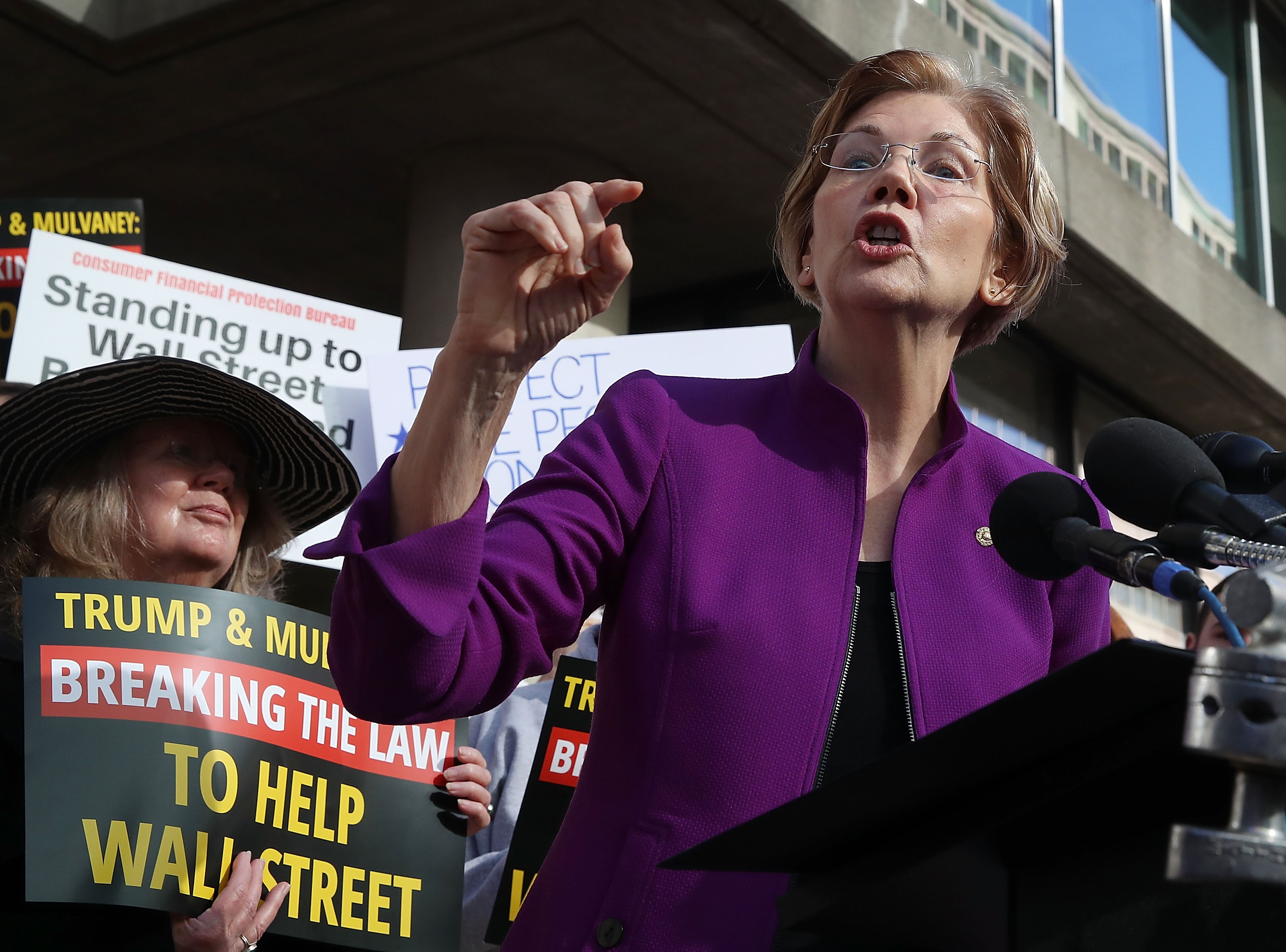 Sen. Elizabeth Warren (D-MA) speaks during a protest in front of the
Consumer Financial Protection Bureau (CFPB) headquarters (Photo by Mark Wilson/Getty Images)