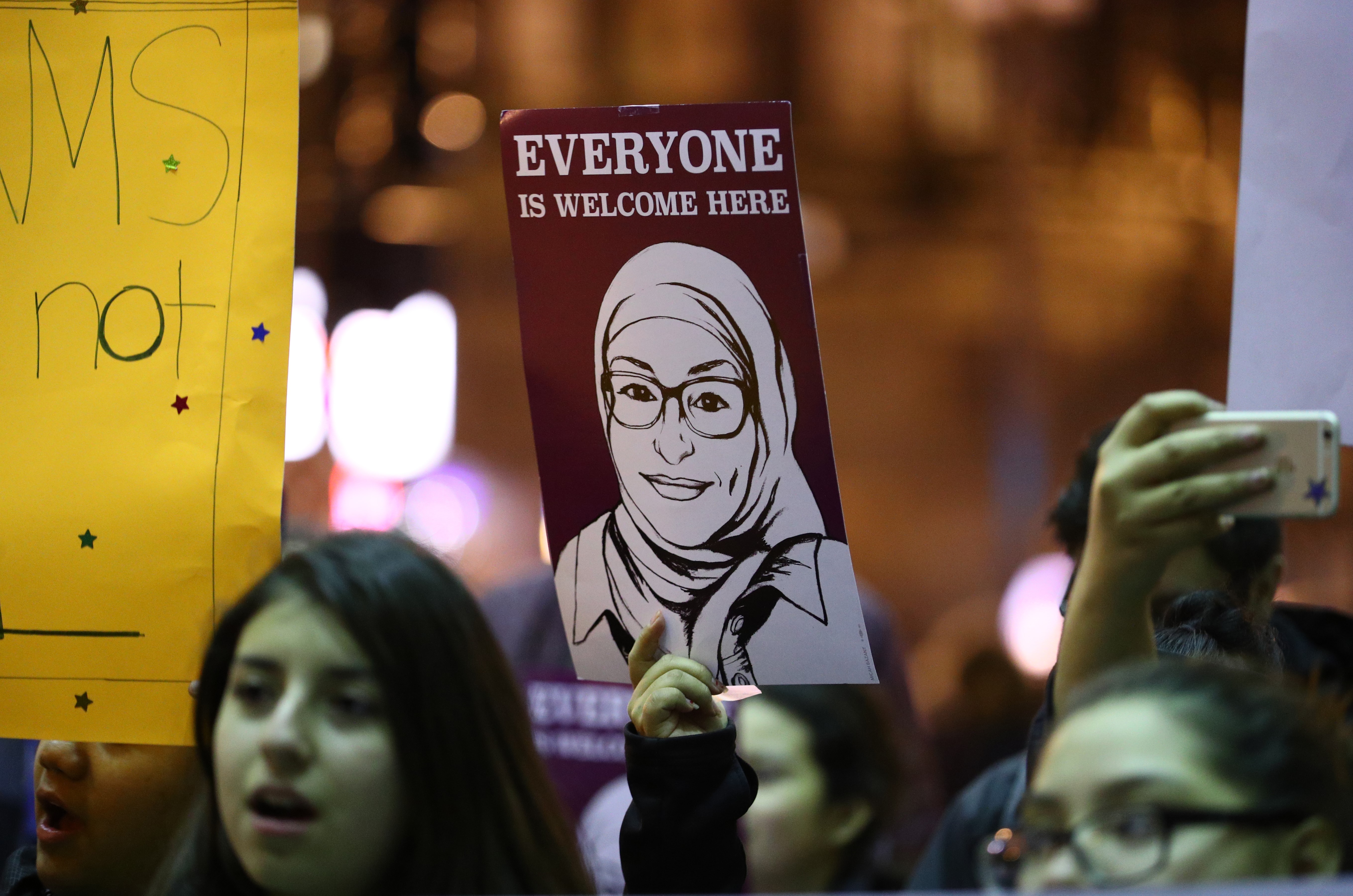 CHICAGO, USA - DECEMBER 19: People, mostly "Dreamers", which is a group of illegal refugees' children those who live in United States, hold placards during a protest, demanding arrangements about the Deferred Action for Childhood Arrivals (DACA) programme, which regulates the protection of illegal refugees' children, before end of the year at Federal Plaza Square in Chicago, United States on December 19, 2017. (Photo by Bilgin S. Sasmaz/Anadolu Agency/Getty Images)