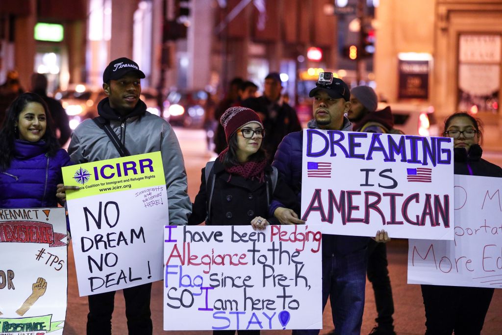 A group of Dreamers holds placards during a protest at Federal Plaza Square in Chicago, Illinois on December 19, 2017. (CREDIT: Bilgin S. Sasmaz/Anadolu Agency/Getty Images)