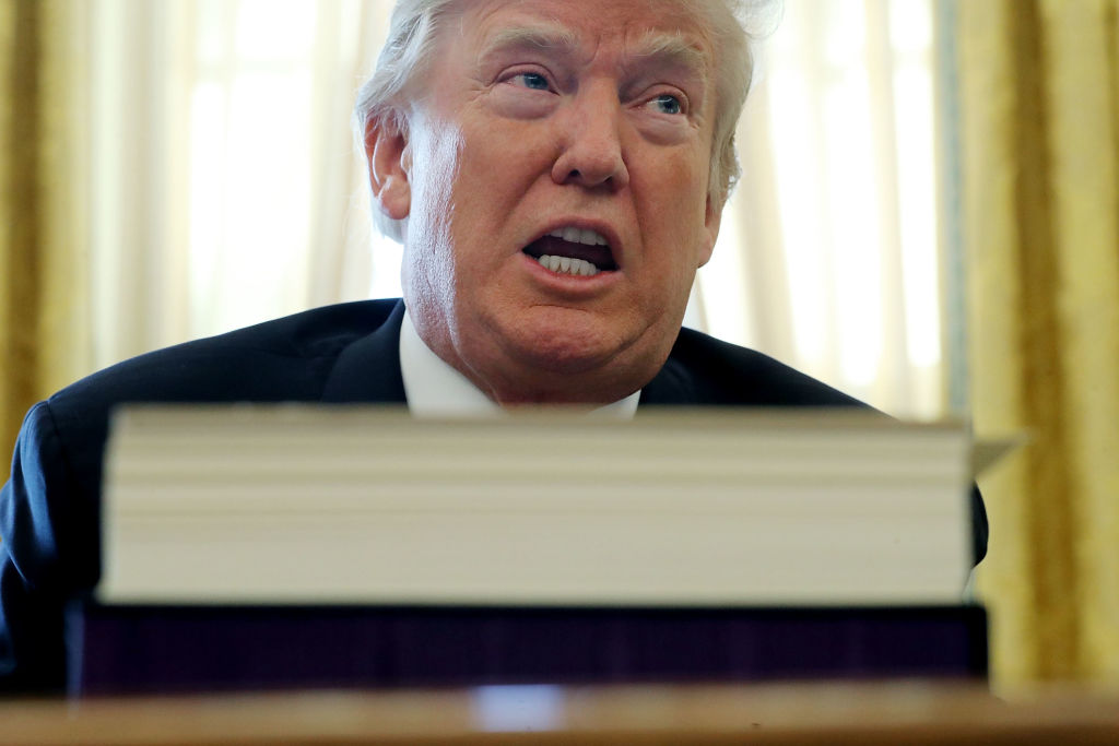 President Trump talks with journalists after signing tax reform legislation into law in the Oval Office December 22, 2017 in Washington, D.C. (CREDIT: Photo by Chip Somodevilla/Getty Images)