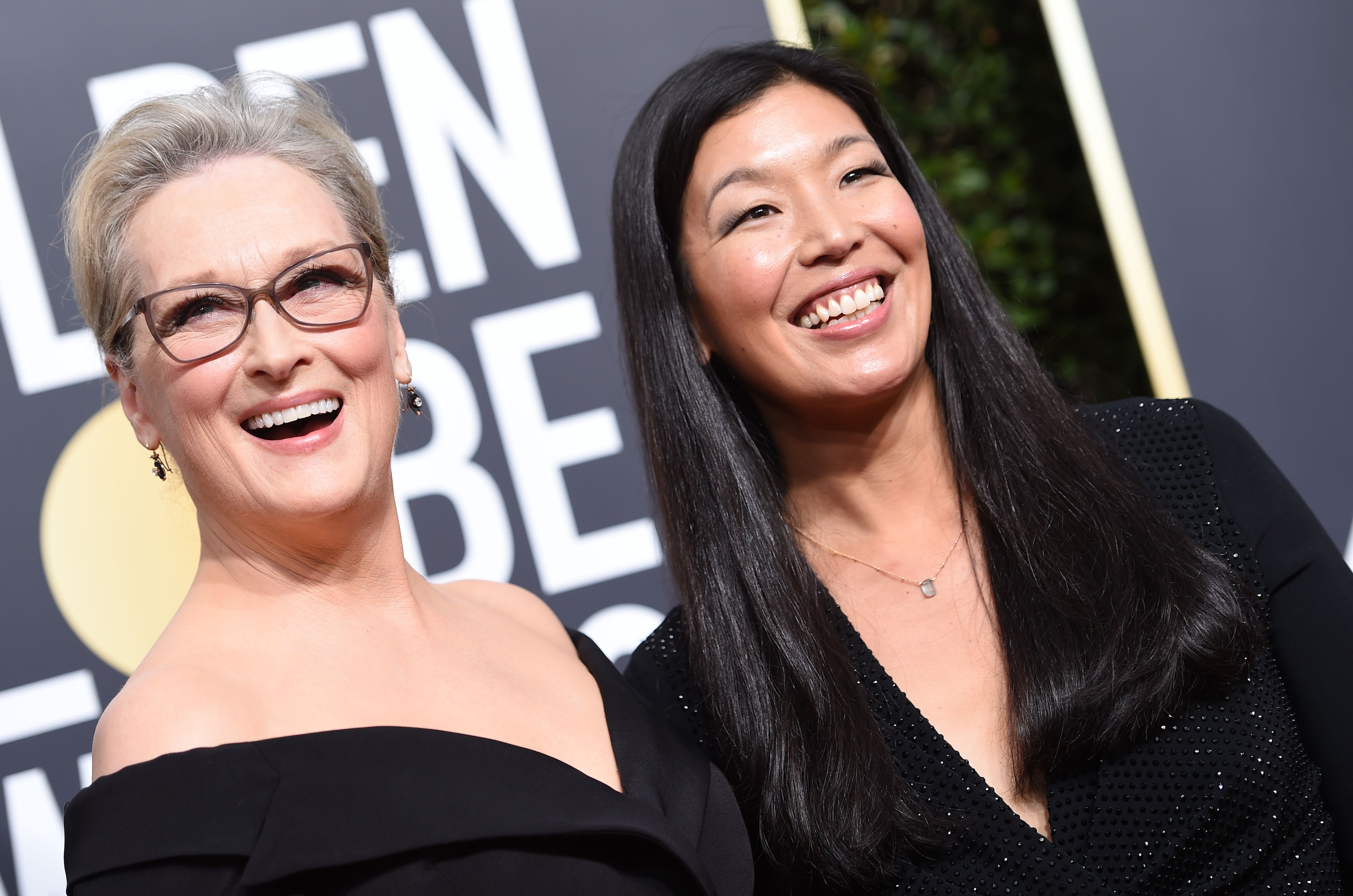 Meryl Streep and Ai-jen Poo, the head of the National Domestic Workers Alliance, arrive for the 75th Golden Globe Awards on January 7, 2018, in Beverly Hills, California. (Photo by VALERIE MACON/AFP/Getty Images)