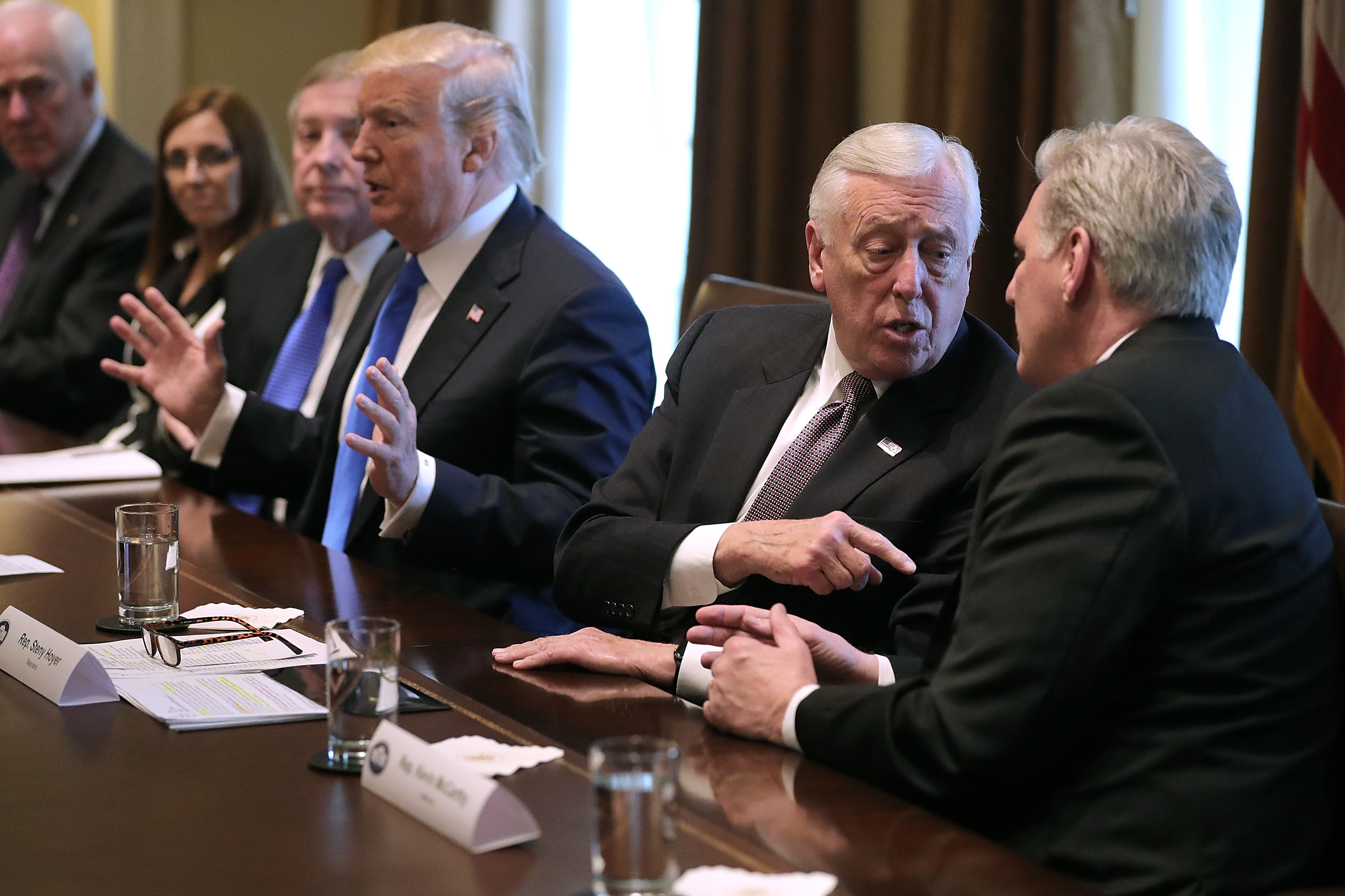 House Majority Leader Kevin McCarthy (R-CA) and House Minority Whip Steny Hoyer (D-MD) debate as U.S. President Donald Trump presides over a meeting about immigration with Republican and Democrat members of Congress in the Cabinet Room at the White House January 9, 2018 in Washington, DC. (CREDIT: Chip Somodevilla/Getty Images)