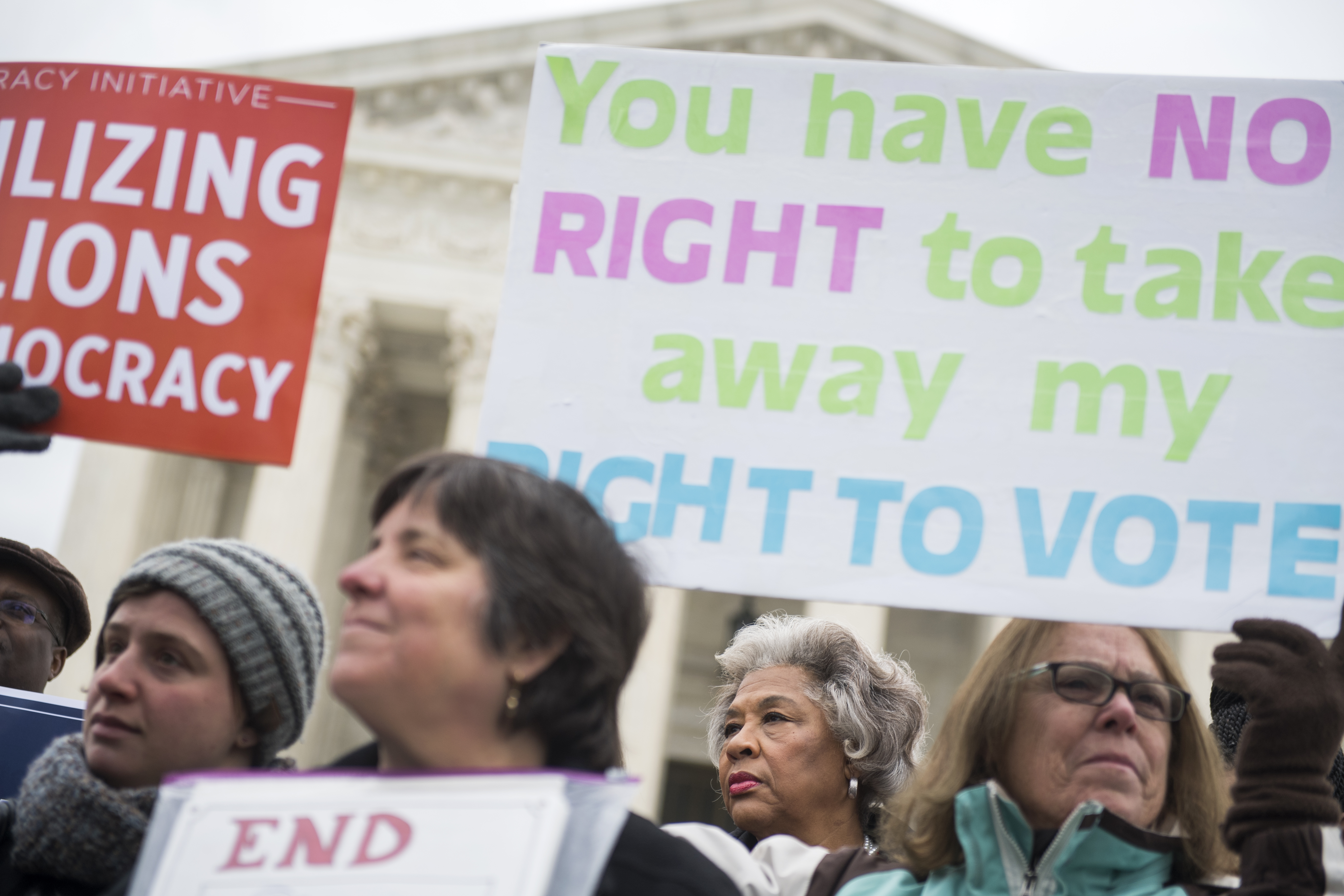 Rep. Joyce Beatty, D-Ohio, second from right, is seen during a rally outside the Supreme Court on January 10, 2018, to oppose Ohio's voter purging system. The court heard arguments on whether Ohio has been too strict in setting in motion a voter registration removal process if the individual hasen't voted in a federal election for two years. (Photo By Tom Williams/CQ Roll Call)
