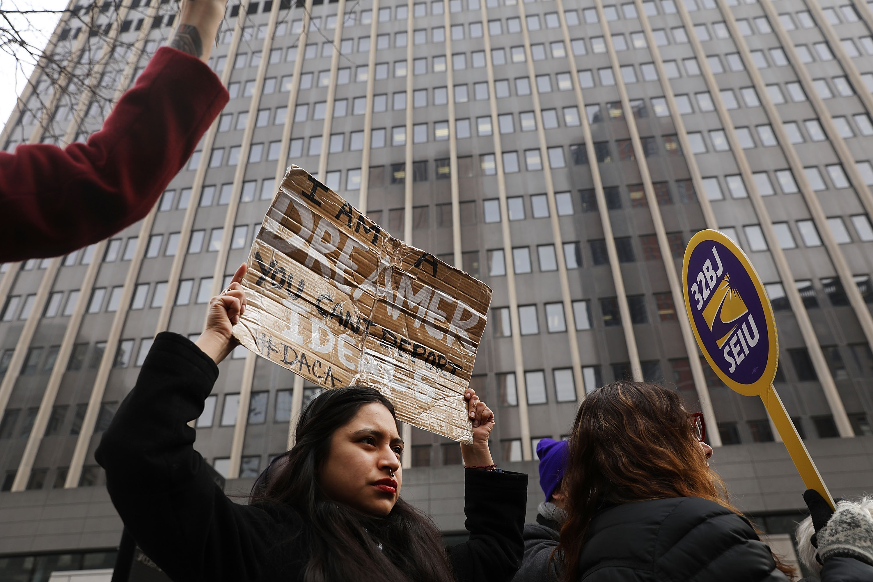 Demonstrators, many of them recent immigrants to America, protest the government shutdown and the lack of a deal on DACA (Deferred Action for Childhood Arrivals) outside of Federal Plaza on January 22, 2018 in New York City. CREDIT: Photo by Spencer Platt/Getty Images