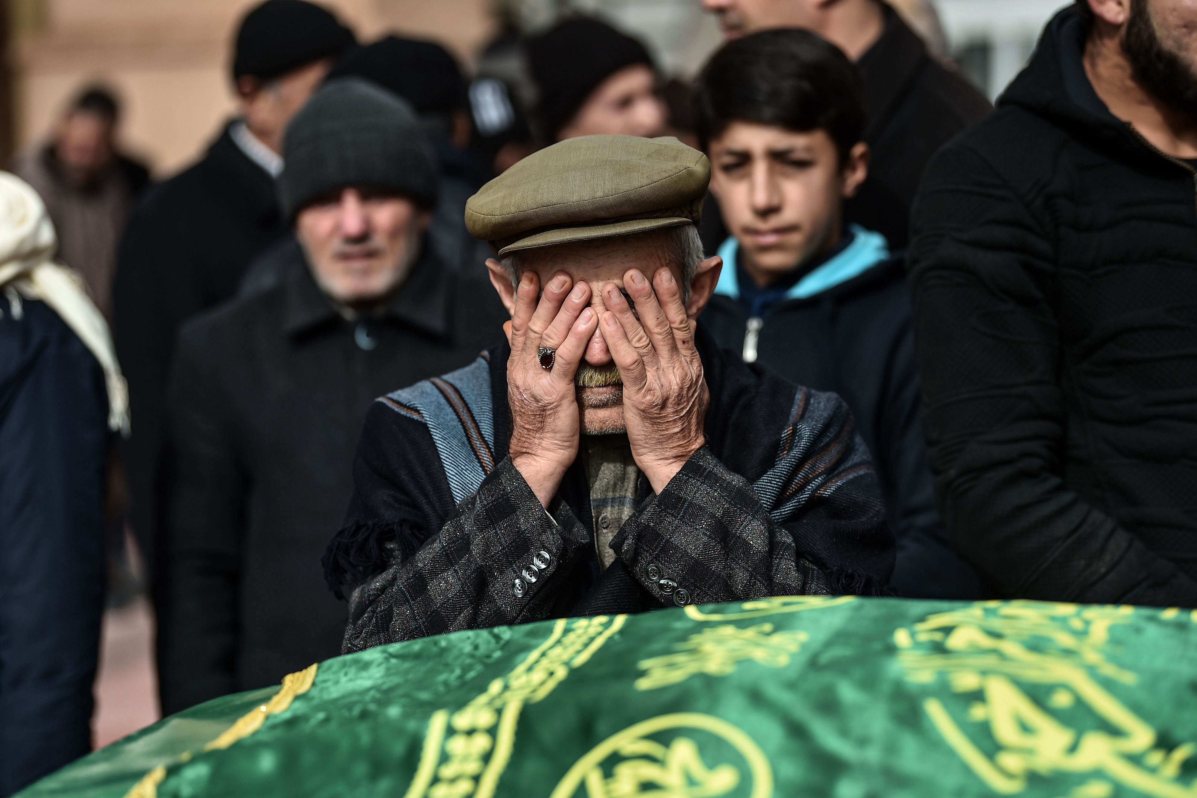 A relative mourns during the funeral ceremony of two people killed by rocket fire in Kilis, a town close to the Syrian border on January 25, 2018. CREDIT: Ozan Kose/AFP/Getty Images.