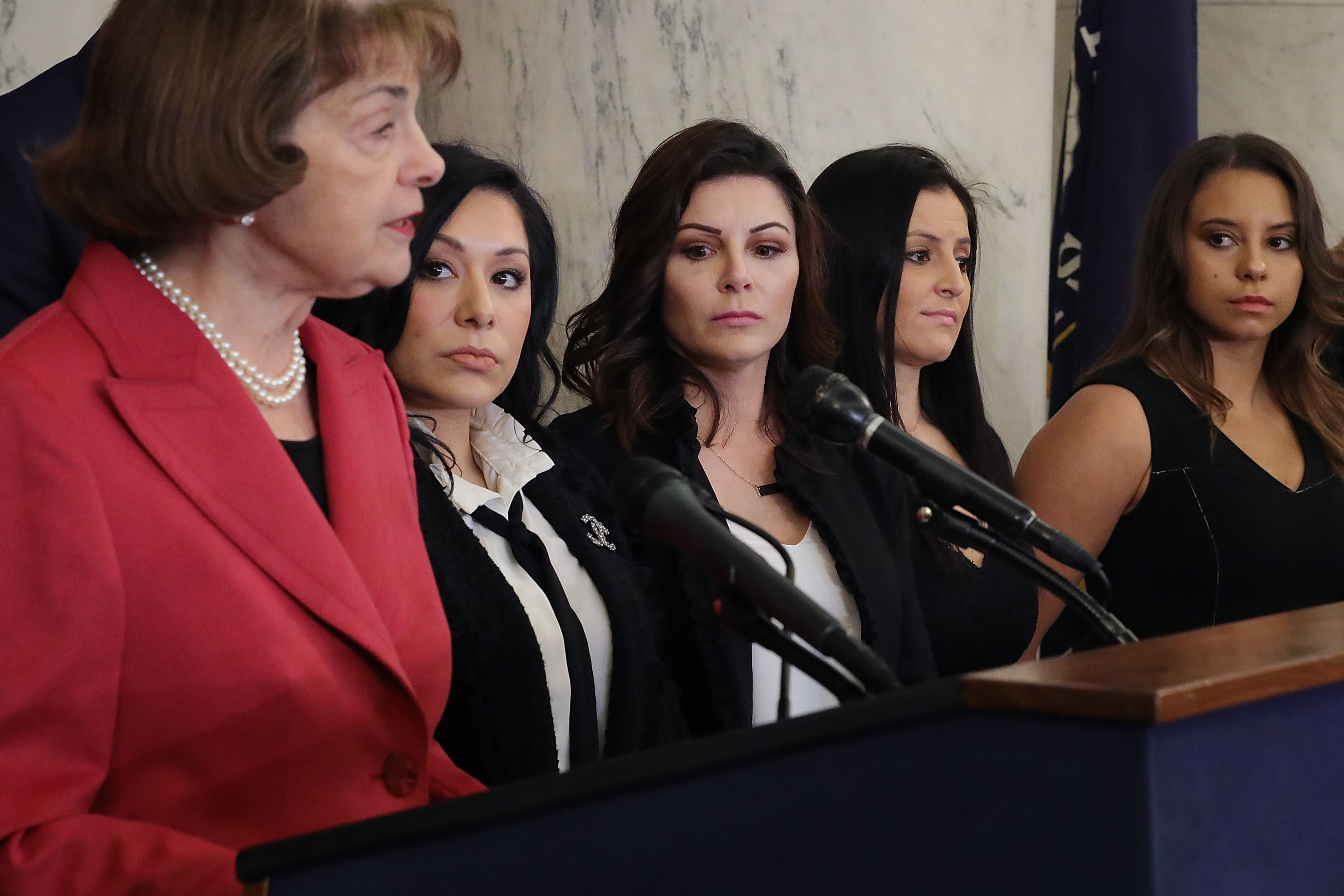 WASHINGTON, DC - JANUARY 30: Sen. Dianne Feinstein (D-CA) (L) speaks during a news conference to discuss new legislation to protect athletes with (2nd L-R) gymnasts Dominique Moceanu, Jeanette Antolin, Jamie Dantzscher and Mattie Larson (Photo by Chip Somodevilla/Getty Images)