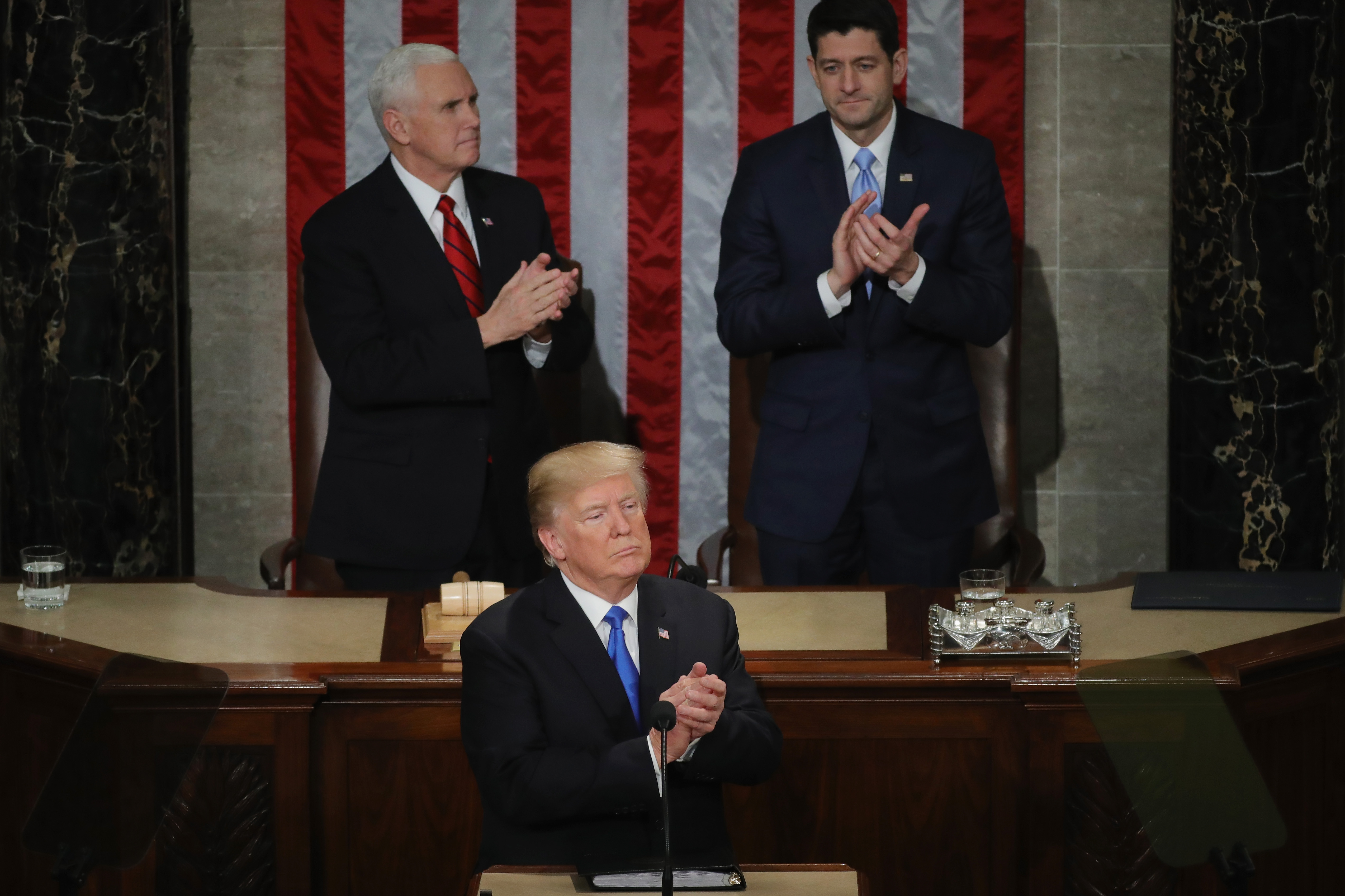 U.S. President Donald J. Trump delivers the State of the Union address as U.S. Vice President Mike Pence (L) and Speaker of the House U.S. Rep. Paul Ryan (R-WI) (R) look on in the chamber of the U.S. House of Representatives January 30, 2018 in Washington, DC. (Photo by Chip Somodevilla/Getty Images)