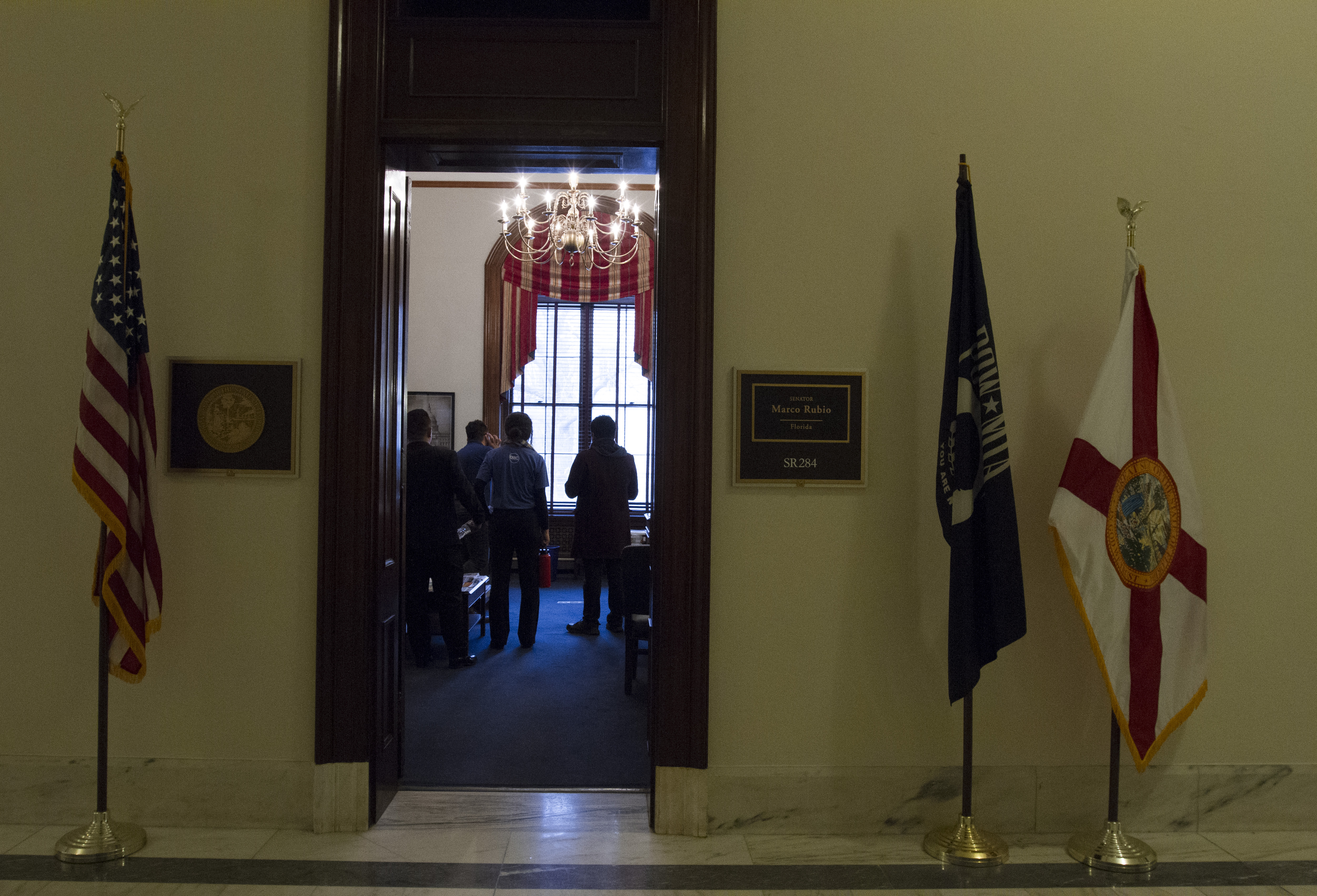 Maria, Seven Flores, 23, and Francisco Luna, 27, wait in the office of Sen. Marco Rubio (R-FL) on Dec. 8, 2017. (Credit: Megan Janetsky)