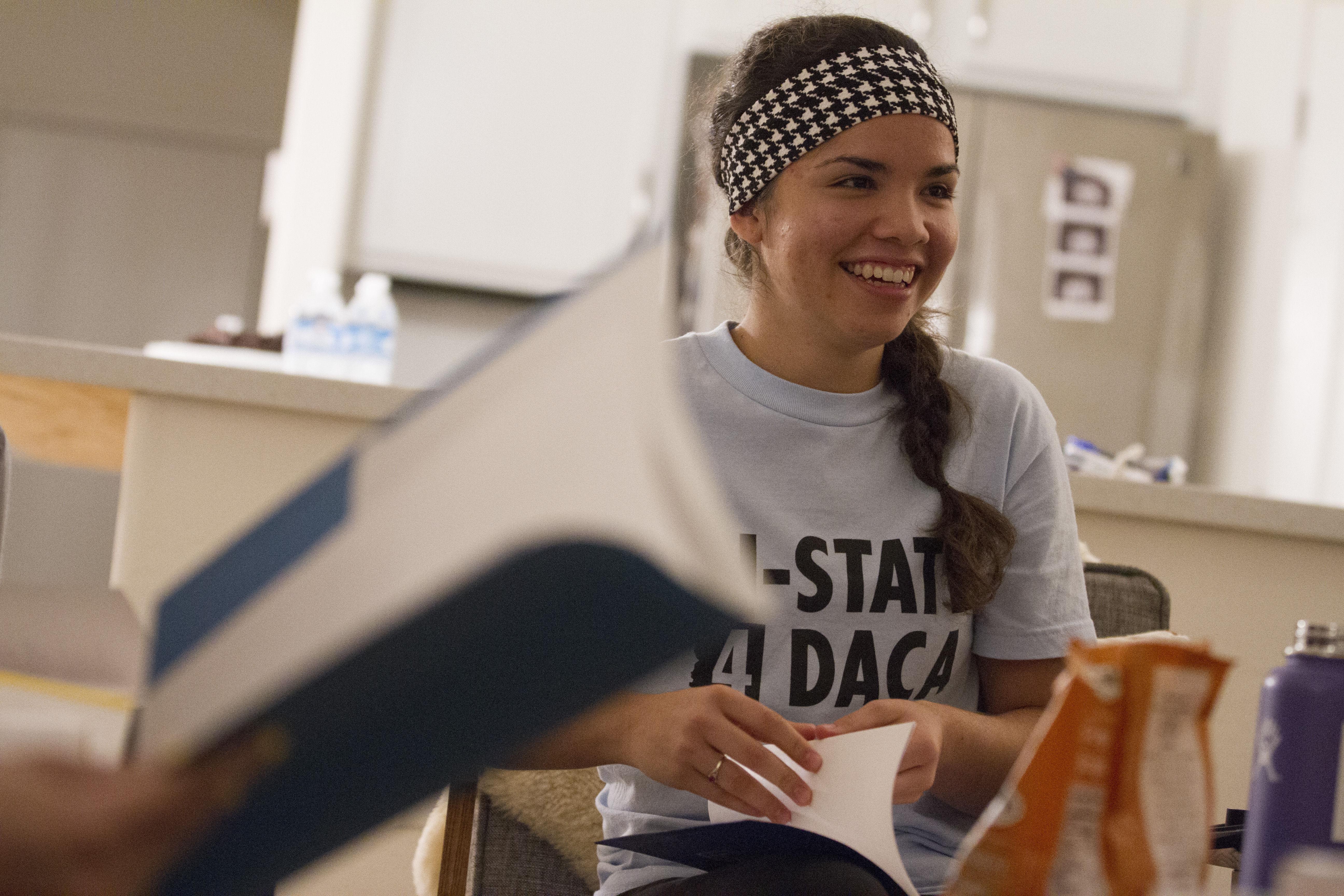 Maria, a leader at her local YoungLife chapter, a Christian youth organization, speaks to her group about how DACA has impacted her life, wearing a shirt reading "IN-STATE 4 DACA" on Sept. 21, 2017. (CREDIT: Megan Janetsky)