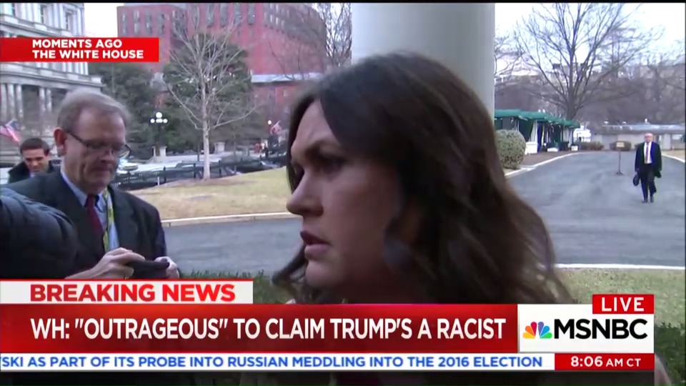 Sarah Huckabee Sanders talks to reporters on Monday.