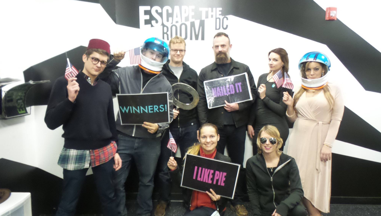 The unknown face in this photo of Chelsea Manning and far-right conspiracy theorists has been identified. (CREDIT: FACEBOOK)