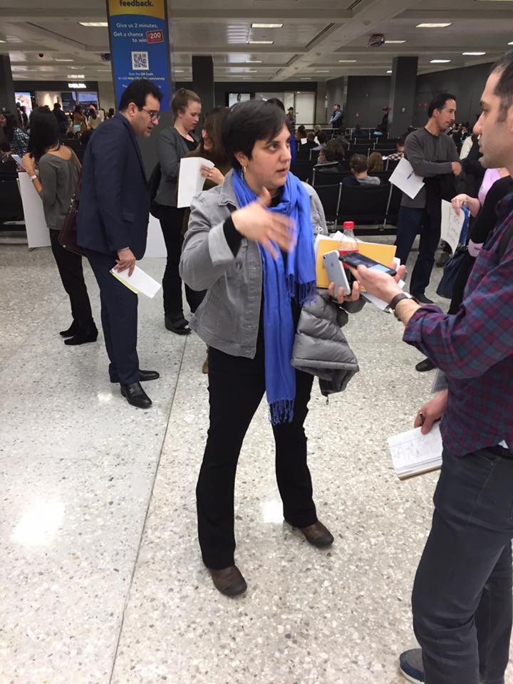 Sirine Shebaya, senior staff attorney at Muslim Advocates, talks to people at Dulles International Airport in January 2017. (Photo: Ava Benach)