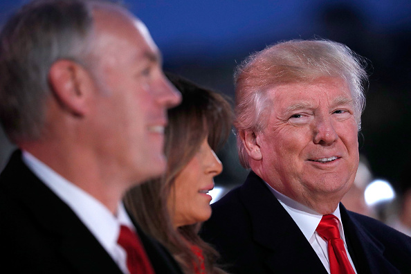 Secretary of the Interior Ryan Zinke, foreground, and President Donald Trump want to open huge offshore areas to oil and gas drilling. CREDIT: Paul Morigi/Getty Images