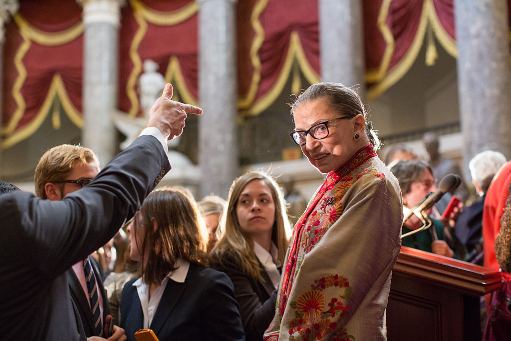 WASHINGTON, DC - MARCH 18: U.S. Supreme Court Justice Ruth Bader Ginsburg greets participants at an annual Women's History Month reception hosted by Pelosi in the U.S. capitol building on Capitol Hill in Washington, D.C. This year's event honored the women Justices of the U.S. Supreme Court: Associate Justices Ruth Bader Ginsburg, Sonia Sotomayor, and Elena Kagan. (Photo by Allison Shelley/Getty Images)